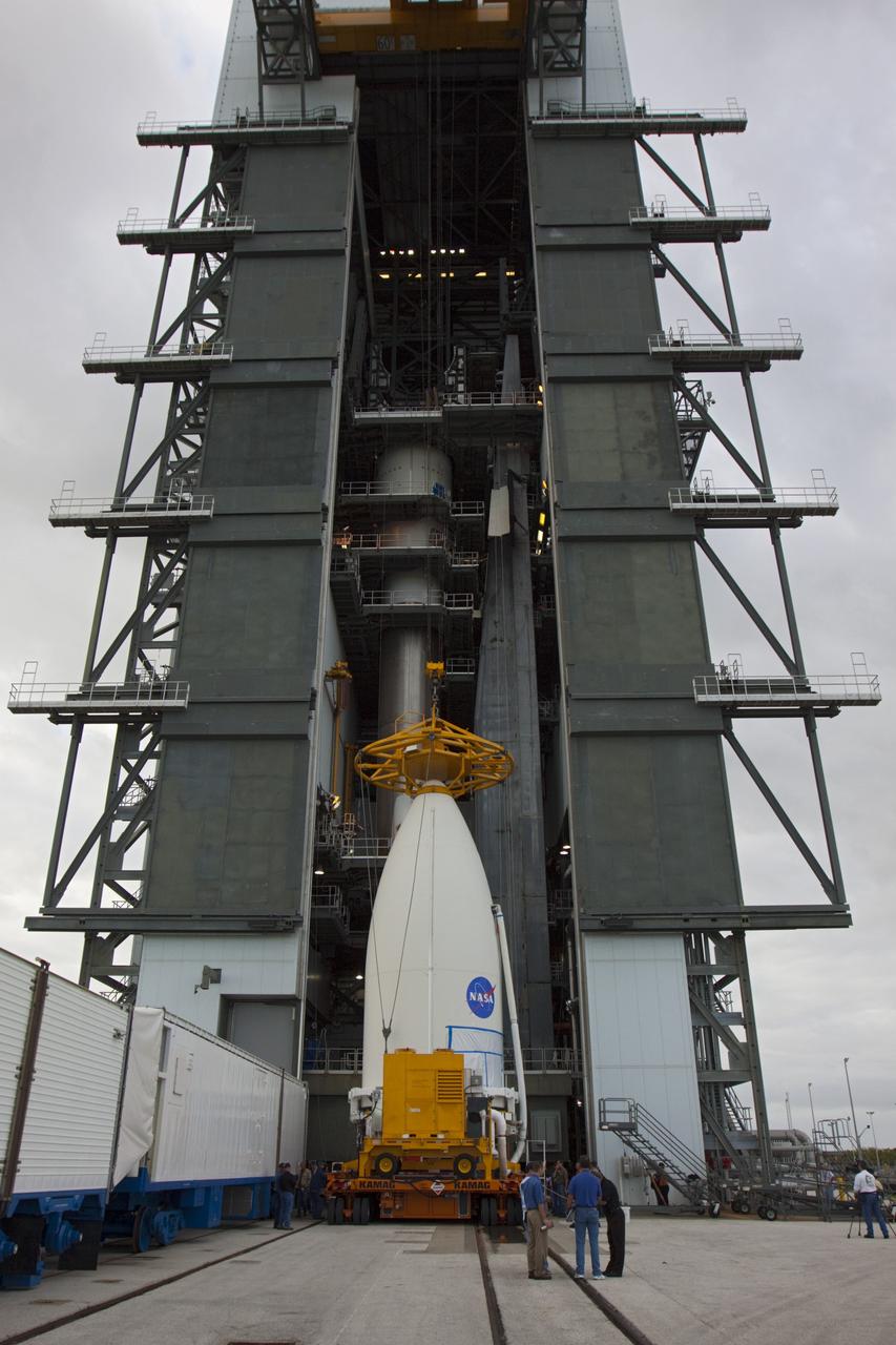 CAPE CANAVERAL, Fla. -- The Vertical Integration Facility at Space Launch Complex 41 towers above the payload fairing containing NASA's Mars Science Laboratory (MSL) spacecraft as activities begin to lift and mate the fairing to the Atlas V rocket already in place. The fairing will protect the payload from heat and aerodynamic pressure generated during ascent. MSL was prepared for launch in the Payload Hazardous Servicing Facility at NASA's Kennedy Space Center. MSL's components include a compact car-sized rover, Curiosity, which has 10 science instruments designed to search for evidence on whether Mars has had environments favorable to microbial life, including the chemical ingredients for life. The unique rover will use a laser to look inside rocks and release its gasses so that the rover’s spectrometer can analyze and send the data back to Earth. Launch of MSL aboard a United Launch Alliance Atlas V rocket is planned for Nov. 25 from Space Launch Complex 41 on Cape Canaveral Air Force Station. For more information, visit http://www.nasa.gov/msl. Photo credit: NASA/Kim Shiflett