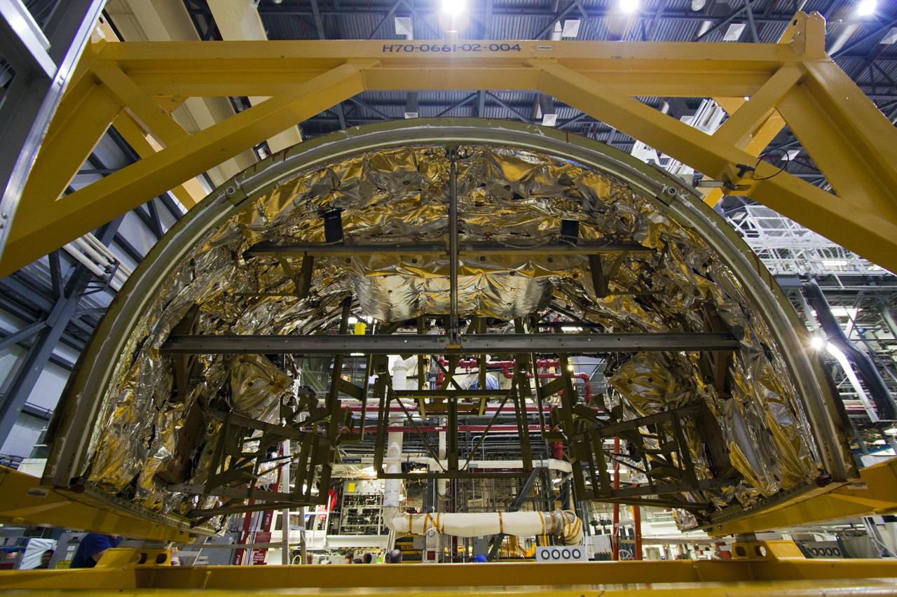 CAPE CANAVERAL, Fla. -- Inside Orbiter Processing Facility-1 at NASA’s Kennedy Space Center in Florida, the forward reaction control system (FRCS) is being moved by crane for installation on space shuttle Discovery.    The FRCS was returned from White Sands Space Harbor in New Mexico where it underwent a complete deservicing and cleaning. The work is part of the Space Shuttle Program’s transition and retirement processing of shuttle Discovery. Discovery is being prepared for display at Smithsonian’s National Air and Space Museum, Steven F. Udvar-Hazy Center in Chantilly, Va. For more information, visit http://www.nasa.gov/shuttle.  Photo credit: NASA/Jim Grossmann