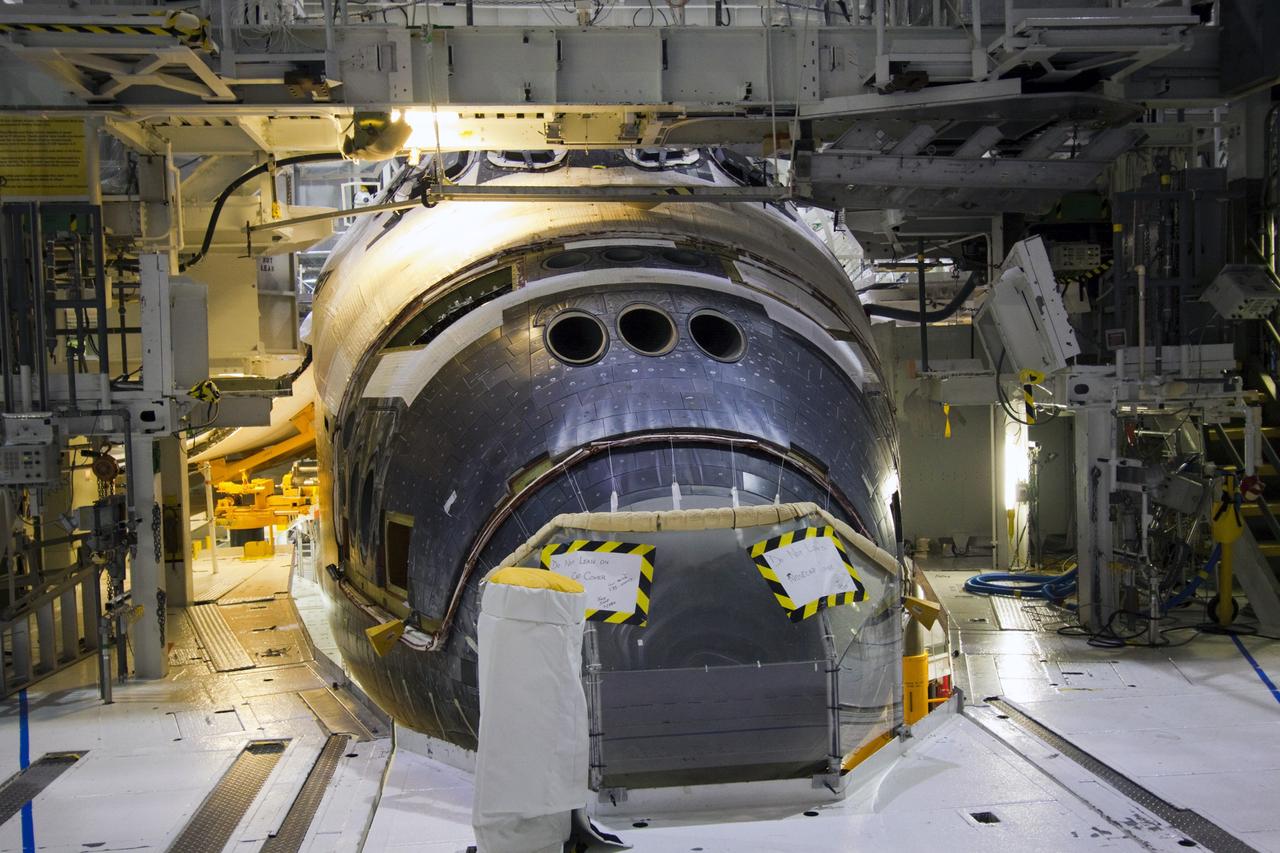 CAPE CANAVERAL, Fla. -- Inside Orbiter Processing Facility-1 at NASA’s Kennedy Space Center in Florida, the forward reaction control system (FRCS) is installed on space shuttle Discovery.    The FRCS was returned from White Sands Space Harbor in New Mexico where it underwent a complete deservicing and cleaning. The work is part of the Space Shuttle Program’s transition and retirement processing of shuttle Discovery. Discovery is being prepared for display at Smithsonian’s National Air and Space Museum, Steven F. Udvar-Hazy Center in Chantilly, Va. For more information, visit http://www.nasa.gov/shuttle.  Photo credit: NASA/Jim Grossmann