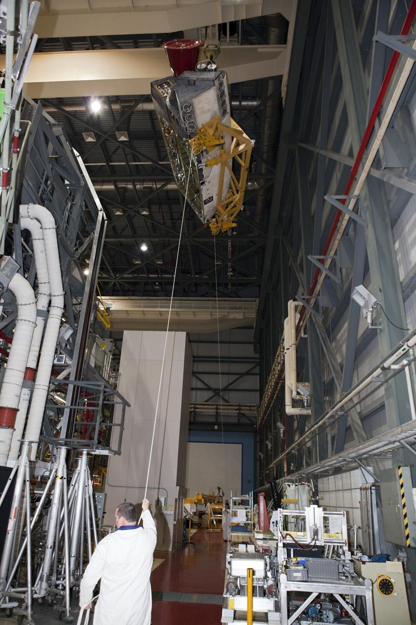 CAPE CANAVERAL, Fla. – Inside Orbiter Processing Facility-2 at NASA’s Kennedy Space Center in Florida, a large crane is being used to move the right orbital maneuvering system (OMS) pod away from space shuttle Atlantis.    The work is part of the Space Shuttle Program’s transition and retirement processing of shuttle Atlantis. Both OMS pods will be removed and sent to White Sands Space Harbor in New Mexico where they will undergo a complete deservicing and cleaning and then be returned to Kennedy for reinstallation on Atlantis. Atlantis is being prepared for display at the Kennedy Space Center Visitor Complex.  Photo credit: NASA/Dimitri Gerondidakis