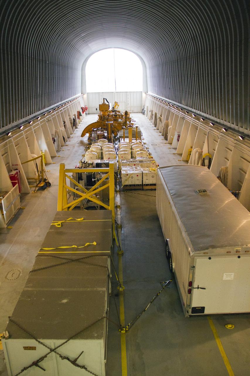 CAPE CANAVERAL, Fla. – At the Turn Basin in the Launch Complex 39 area of NASA’s Kennedy Space Center in Florida, space shuttle main engine (SSME) ground support equipment is stowed away inside the Pegasus barge, ready for transport for delivery to Stennis Space Center near Bay St. Louis, Miss. Since being delivered to NASA in 1999, Pegasus sailed 41 times and transported 31 shuttle external fuel tanks from Michoud Assembly Facility near New Orleans to Kennedy. The barge will leave Kennedy, perhaps for the final time. Both the barge and shuttle equipment will remain in storage until their specific future uses are determined. The SSMEs themselves will be transported to Stennis separately for use with the agency’s new heavy-lift rocket, the Space Launch System. The work is part of the Space Shuttle Program’s transition and retirement processing. For more information about Shuttle Transition and Retirement, visit http://www.nasa.gov/mission_pages/transition/home/index.html. Photo credit: NASA/Cory Huston