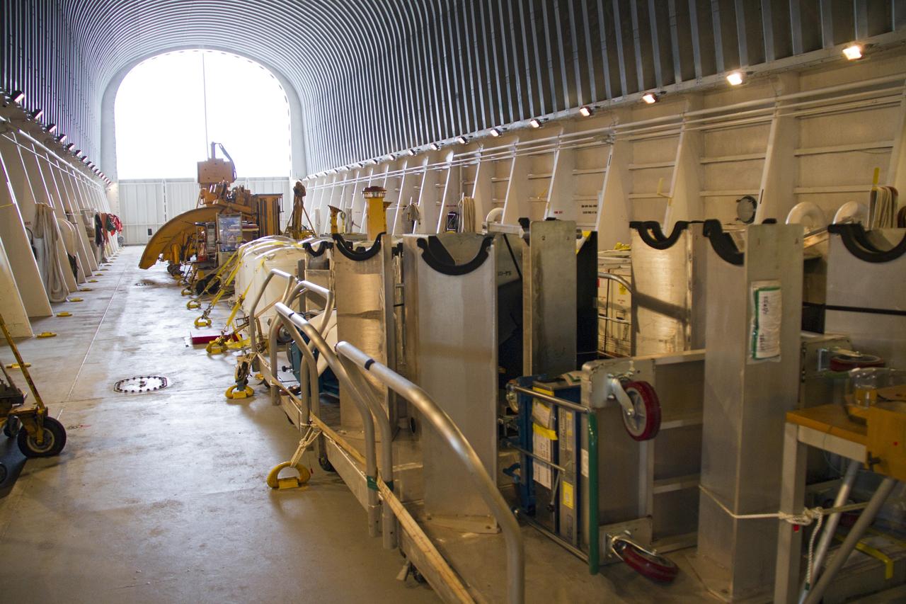 CAPE CANAVERAL, Fla. – At the Turn Basin in the Launch Complex 39 area of NASA’s Kennedy Space Center in Florida, space shuttle main engine (SSME) ground support equipment is stowed away inside the Pegasus barge, ready for transport for delivery to Stennis Space Center near Bay St. Louis, Miss. Since being delivered to NASA in 1999, Pegasus sailed 41 times and transported 31 shuttle external fuel tanks from Michoud Assembly Facility near New Orleans to Kennedy. The barge will leave Kennedy, perhaps for the final time. Both the barge and shuttle equipment will remain in storage until their specific future uses are determined. The SSMEs themselves will be transported to Stennis separately for use with the agency’s new heavy-lift rocket, the Space Launch System. The work is part of the Space Shuttle Program’s transition and retirement processing. For more information about Shuttle Transition and Retirement, visit http://www.nasa.gov/mission_pages/transition/home/index.html. Photo credit: NASA/Cory Huston
