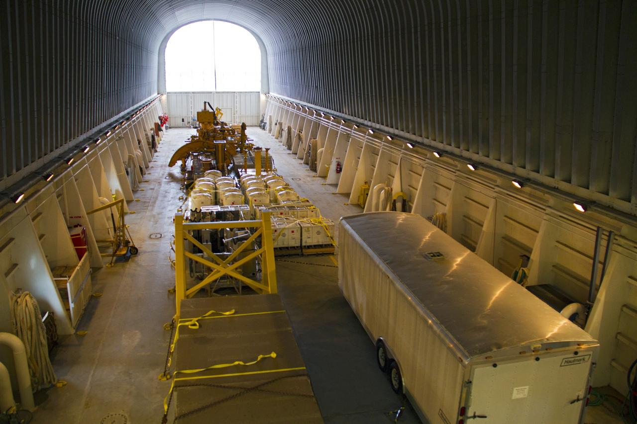 CAPE CANAVERAL, Fla. – At the Turn Basin in the Launch Complex 39 area of NASA’s Kennedy Space Center in Florida, space shuttle main engine (SSME) ground support equipment is stowed away inside the Pegasus barge, ready for transport for delivery to Stennis Space Center near Bay St. Louis, Miss. Since being delivered to NASA in 1999, Pegasus sailed 41 times and transported 31 shuttle external fuel tanks from Michoud Assembly Facility near New Orleans to Kennedy. The barge will leave Kennedy, perhaps for the final time. Both the barge and shuttle equipment will remain in storage until their specific future uses are determined. The SSMEs themselves will be transported to Stennis separately for use with the agency’s new heavy-lift rocket, the Space Launch System. The work is part of the Space Shuttle Program’s transition and retirement processing. For more information about Shuttle Transition and Retirement, visit http://www.nasa.gov/mission_pages/transition/home/index.html. Photo credit: NASA/Cory Huston