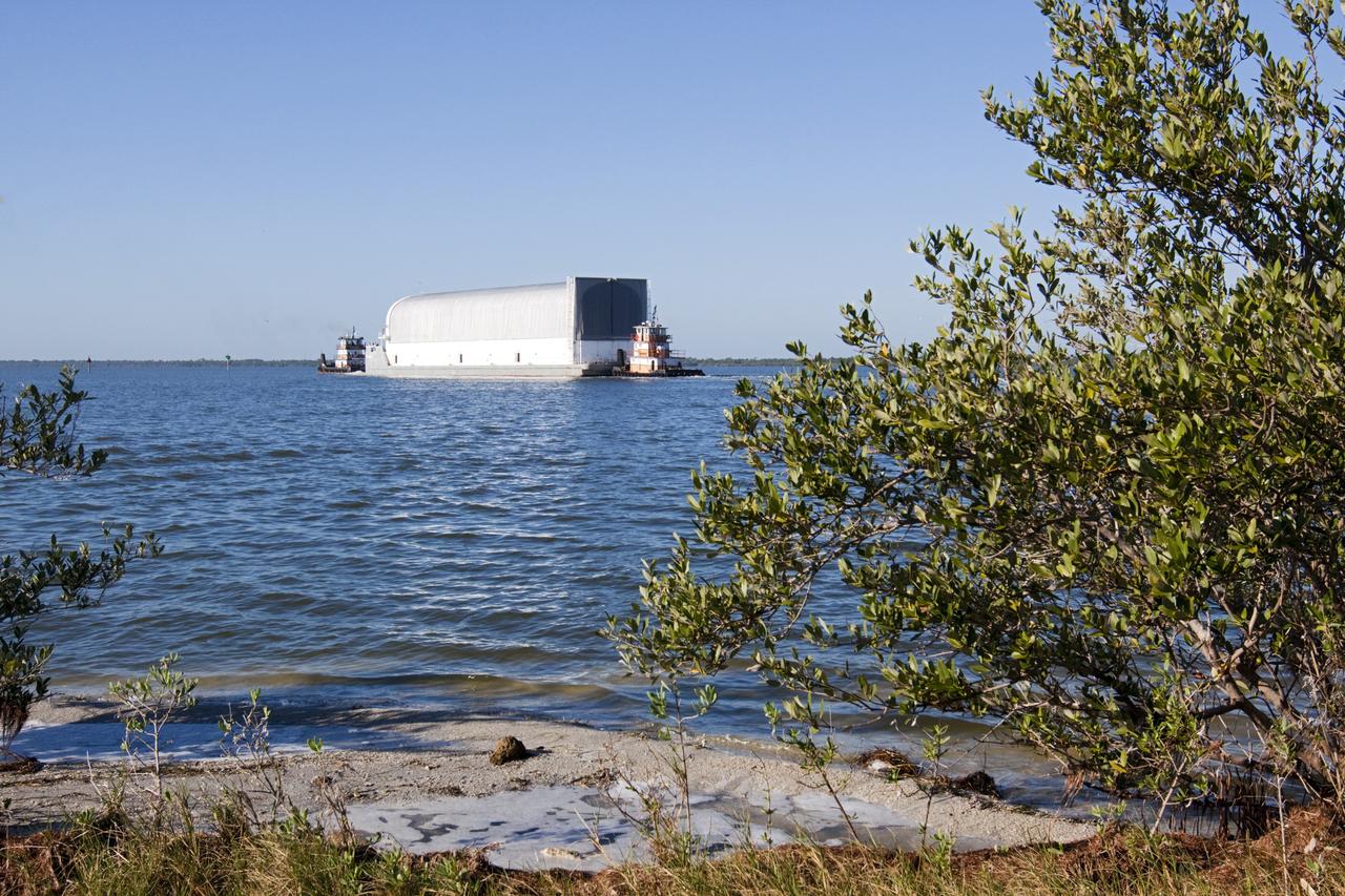 CAPE CANAVERAL, Fla. – Tugboats maneuver the Pegasus Barge through the Banana River after leaving NASA's Kennedy Space Center in Florida. The 266-foot-long and 50-foot-wide barge will be towed by NASA's Freedom Star ship to deliver space shuttle main engine (SSME) ground support equipment to Stennis Space Center near Bay St. Louis, Miss. Since being delivered to NASA in 1999, Pegasus sailed 41 times and transported 31 shuttle external fuel tanks from Michoud Assembly Facility near New Orleans to Kennedy. The barge is leaving Kennedy, perhaps for the final time. Both the barge and shuttle equipment will remain in storage until their specific future uses are determined. The SSMEs themselves will be transported to Stennis separately for use with the agency's new heavy-lift rocket, the Space Launch System. The work is part of the Space Shuttle Program’s transition and retirement processing. For more information about Shuttle Transition and Retirement, visit http://www.nasa.gov/mission_pages/transition/home/index.html. Photo credit: NASA/Kim Shiflett