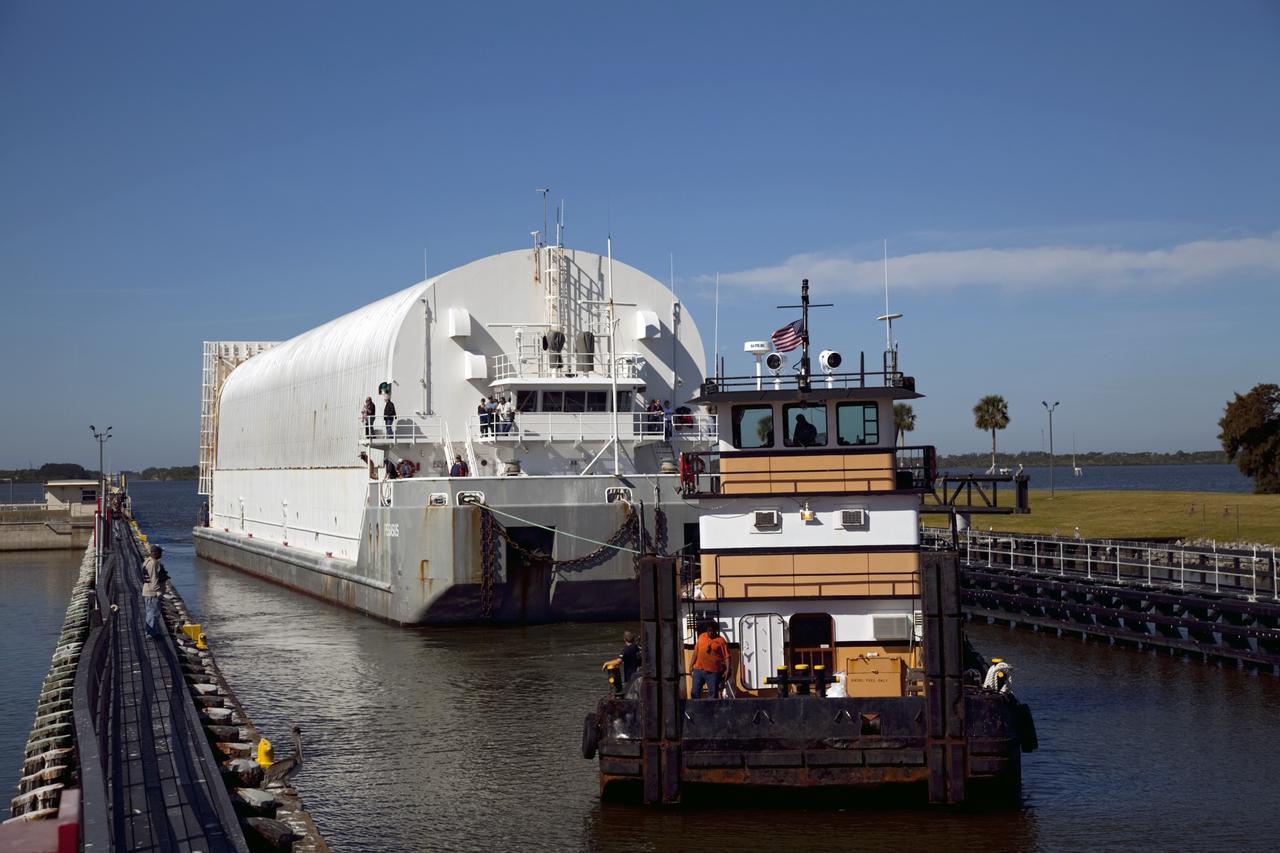 CAPE CANAVERAL, Fla. – A tugboat pulls NASA's Pegasus Barge through the Port Canaveral lock in Florida. The 266 ft long and 50 ft wide barge will be towed by NASA's Freedom Star ship to deliver space shuttle main engine (SSME) ground support equipment to Stennis Space Center near Bay St. Louis, Miss. Since being delivered to NASA in 1999, Pegasus sailed 41 times and transported 31 shuttle external fuel tanks from Michoud Assembly Facility near New Orleans to Kennedy Space Center. The barge is leaving Kennedy, perhaps for the final time. Both the barge and shuttle equipment will remain in storage until their specific future uses are determined. The SSMEs themselves will be transported to Stennis separately for use with the agency's new heavy-lift rocket, the Space Launch System. The work is part of the Space Shuttle Program’s transition and retirement processing. For more information about Shuttle Transition and Retirement, visit http://www.nasa.gov/mission_pages/transition/home/index.html. Photo credit: NASA/Frankie Martin