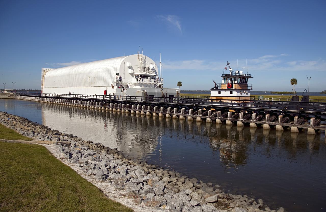 CAPE CANAVERAL, Fla. – A tugboat pulls NASA's Pegasus Barge through the Port Canaveral lock in Florida. The 266-foot-long and 50-foot-wide barge will be towed by NASA's Freedom Star ship to deliver space shuttle main engine (SSME) ground support equipment to Stennis Space Center near Bay St. Louis, Miss. Since being delivered to NASA in 1999, Pegasus sailed 41 times and transported 31 shuttle external fuel tanks from Michoud Assembly Facility near New Orleans to Kennedy Space Center. The barge is leaving Kennedy, perhaps for the final time. Both the barge and shuttle equipment will remain in storage until their specific future uses are determined. The SSMEs themselves will be transported to Stennis separately for use with the agency's new heavy-lift rocket, the Space Launch System. The work is part of the Space Shuttle Program’s transition and retirement processing. For more information about Shuttle Transition and Retirement, visit http://www.nasa.gov/mission_pages/transition/home/index.html. Photo credit: NASA/Frankie Martin