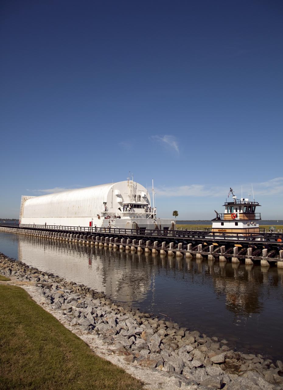 CAPE CANAVERAL, Fla. – A tugboat pulls NASA's Pegasus Barge through the Port Canaveral lock in Florida. The 266-foot-long and 50-foot-wide barge will be towed by NASA's Freedom Star ship to deliver space shuttle main engine (SSME) ground support equipment to Stennis Space Center near Bay St. Louis, Miss. Since being delivered to NASA in 1999, Pegasus sailed 41 times and transported 31 shuttle external fuel tanks from Michoud Assembly Facility near New Orleans to Kennedy Space Center. The barge is leaving Kennedy, perhaps for the final time. Both the barge and shuttle equipment will remain in storage until their specific future uses are determined. The SSMEs themselves will be transported to Stennis separately for use with the agency's new heavy-lift rocket, the Space Launch System. The work is part of the Space Shuttle Program’s transition and retirement processing. For more information about Shuttle Transition and Retirement, visit http://www.nasa.gov/mission_pages/transition/home/index.html. Photo credit: NASA/Frankie Martin