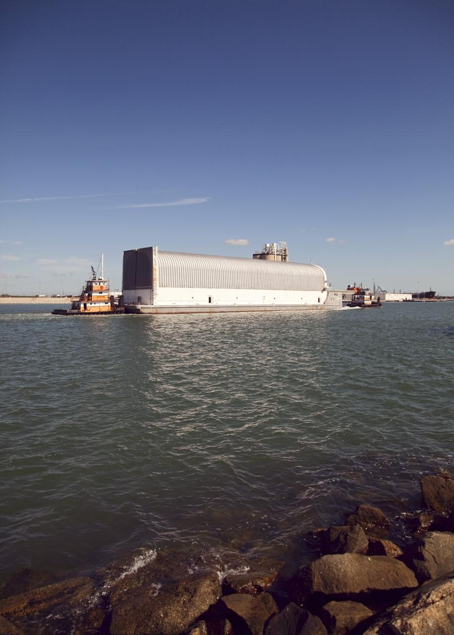 CAPE CANAVERAL, Fla. – Tugboats maneuver the Pegasus Barge through Port Canaveral after leaving NASA's Kennedy Space Center in Florida. The 266-foot-long and 50-foot-wide barge will be towed by NASA's Freedom Star ship to deliver space shuttle main engine (SSME) ground support equipment to Stennis Space Center near Bay St. Louis, Miss. Since being delivered to NASA in 1999, Pegasus sailed 41 times and transported 31 shuttle external fuel tanks from Michoud Assembly Facility near New Orleans to Kennedy. The barge is leaving Kennedy, perhaps for the final time. Both the barge and shuttle equipment will remain in storage until their specific future uses are determined. The SSMEs themselves will be transported to Stennis separately for use with the agency's new heavy-lift rocket, the Space Launch System. The work is part of the Space Shuttle Program’s transition and retirement processing. For more information about Shuttle Transition and Retirement, visit http://www.nasa.gov/mission_pages/transition/home/index.html. Photo credit: NASA/Frankie Martin