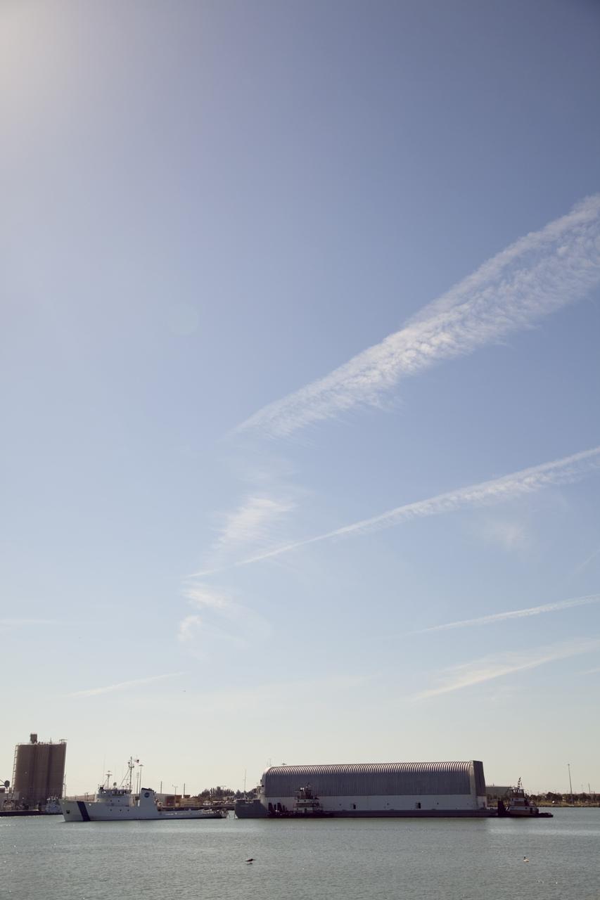 CAPE CANAVERAL, Fla. – NASA's Freedom Star ship tows the Pegasus Barge through Port Canaveral in Florida. Freedom Star is towing the 266-foot-long and 50-foot-wide barge to Stennis Space Center near Bay St. Louis, Miss. to deliver space shuttle main engine (SSME) ground support equipment. Since being delivered to NASA in 1999, Pegasus sailed 41 times and transported 31 shuttle external fuel tanks from Michoud Assembly Facility near New Orleans to Kennedy Space Center. The barge is leaving Kennedy, perhaps for the final time. Both the barge and shuttle equipment will remain in storage until their specific future uses are determined. The SSMEs themselves will be transported to Stennis separately for use with the agency's new heavy-lift rocket, the Space Launch System. The work is part of the Space Shuttle Program’s transition and retirement processing. For more information about Shuttle Transition and Retirement, visit http://www.nasa.gov/mission_pages/transition/home/index.html. Photo credit: NASA/Frankie Martin
