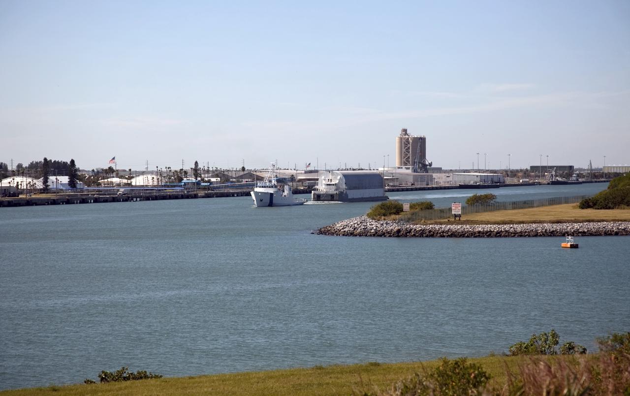 CAPE CANAVERAL, Fla. – NASA's Freedom Star ship tows the Pegasus Barge through Port Canaveral in Florida. Freedom Star is towing the 266-foot-long and 50-foot-wide barge to Stennis Space Center near Bay St. Louis, Miss. to deliver space shuttle main engine (SSME) ground support equipment. Since being delivered to NASA in 1999, Pegasus sailed 41 times and transported 31 shuttle external fuel tanks from Michoud Assembly Facility near New Orleans to Kennedy Space Center. The barge is leaving Kennedy, perhaps for the final time. Both the barge and shuttle equipment will remain in storage until their specific future uses are determined. The SSMEs themselves will be transported to Stennis separately for use with the agency's new heavy-lift rocket, the Space Launch System. The work is part of the Space Shuttle Program’s transition and retirement processing. For more information about Shuttle Transition and Retirement, visit http://www.nasa.gov/mission_pages/transition/home/index.html. Photo credit: NASA/Frankie Martin