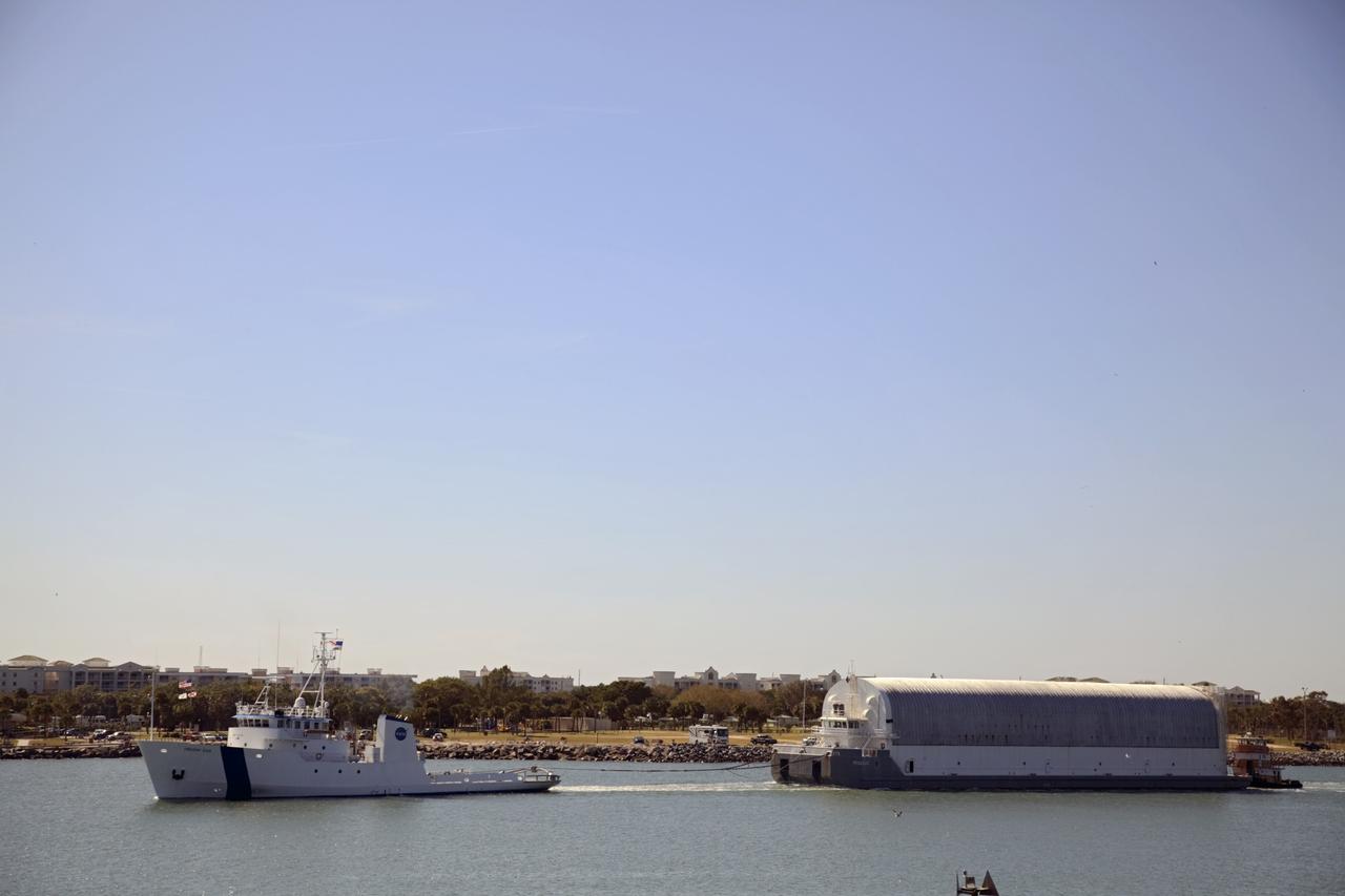 CAPE CANAVERAL, Fla. – NASA's Freedom Star ship tows the Pegasus Barge through Port Canaveral in Florida. Freedom Star is towing the 266-foot-long and 50-foot-wide barge to Stennis Space Center near Bay St. Louis, Miss. to deliver space shuttle main engine (SSME) ground support equipment. Since being delivered to NASA in 1999, Pegasus sailed 41 times and transported 31 shuttle external fuel tanks from Michoud Assembly Facility near New Orleans to Kennedy Space Center. The barge is leaving Kennedy, perhaps for the final time. Both the barge and shuttle equipment will remain in storage until their specific future uses are determined. The SSMEs themselves will be transported to Stennis separately for use with the agency's new heavy-lift rocket, the Space Launch System. The work is part of the Space Shuttle Program’s transition and retirement processing. For more information about Shuttle Transition and Retirement, visit http://www.nasa.gov/mission_pages/transition/home/index.html. Photo credit: NASA/Frankie Martin