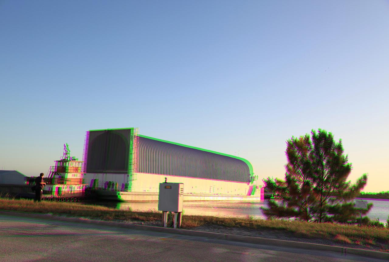CAPE CANAVERAL, Fla. –This 3-D image shows a tugboat beginning to push the Pegasus Barge away from the dock at the Turn Basin in the Launch Complex 39 area at NASA's Kennedy Space Center in Florida. The 266-foot-long and 50-foot-wide barge will be towed by NASA's Freedom Star ship to deliver space shuttle main engine (SSME) ground support equipment to Stennis Space Center near Bay St. Louis, Miss. Since being delivered to NASA in 1999, Pegasus sailed 41 times and transported 31 shuttle external fuel tanks from Michoud Assembly Facility near New Orleans to Kennedy. To view this image, use green and magenta 3-D glasses. The barge is leaving Kennedy, perhaps for the final time. Both the barge and shuttle equipment will remain in storage until their specific future uses are determined. The SSMEs themselves will be transported to Stennis separately for use with the agency's new heavy-lift rocket, the Space Launch System. The work is part of the Space Shuttle Program’s transition and retirement processing. For more information about Shuttle Transition and Retirement, visit http://www.nasa.gov/mission_pages/transition/home/index.html. Photo credit: NASA/Frankie Martin