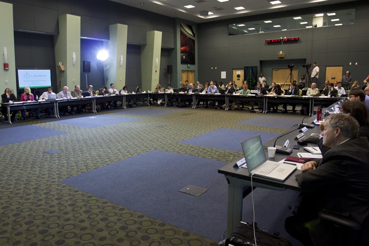 CAPE CANAVERAL, Fla. – In the Operations Support Building (OSB) II at NASA's Kennedy Space Center in Florida, participants listen as speakers discuss innovative ideas with NASA and partners during a three-day LAUNCH: Energy forum Nov. 11-13. This third in a series of forums is part of an ongoing initiative to identify, showcase and support innovative approaches to sustainability challenges. LAUNCH allows NASA to propel innovative solutions that help those outside the agency make the connection between our lives on Earth and how we live and work in space. Through the U.S. Agency for International Development (USAID)'s involvement, LAUNCH places a special emphasis on accelerating innovations poised for large scale impact in improving the lives of people in the developing world. During the forum, 10 international participants will showcase new innovations that could address energy problems on Earth and in space. NASA, USAID, Nike Inc., and the U.S. Department of State are LAUNCH founding partners. The partners all contributed to planning the forum, selecting innovators and recruiting other event participants. Photo credit: NASA/Kim Shiflett