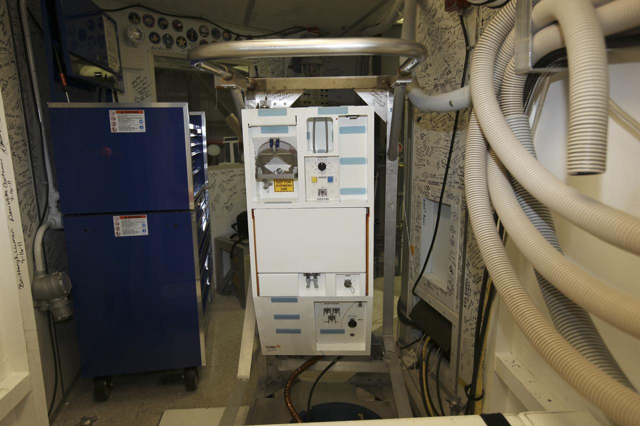 CAPE CANAVERAL, Fla. – Inside Orbiter Processing Facility-1 at NASA’s Kennedy Space Center in Florida, the shuttle orbiter repackaged galley (SORG) is being installed in the middeck of space shuttle Discovery. After Discovery’s final mission, STS-133, the SORG was removed and sent to a United Space Alliance lab in Houston where it was cleaned and deserviced. Water in the microbial check valve and the orbiter water system was drained and dried. The SORG was returned to Kennedy Space Center. The work is part of the Space Shuttle Program’s transition and retirement processing of shuttle Discovery, which is being prepared for display at Smithsonian’s National Air and Space Museum, Steven F. Udvar-Hazy Center in Chantilly, Va. For more information, visit http://www.nasa.gov/shuttle. Photo credit: NASA/Dimitri Gerondidakis