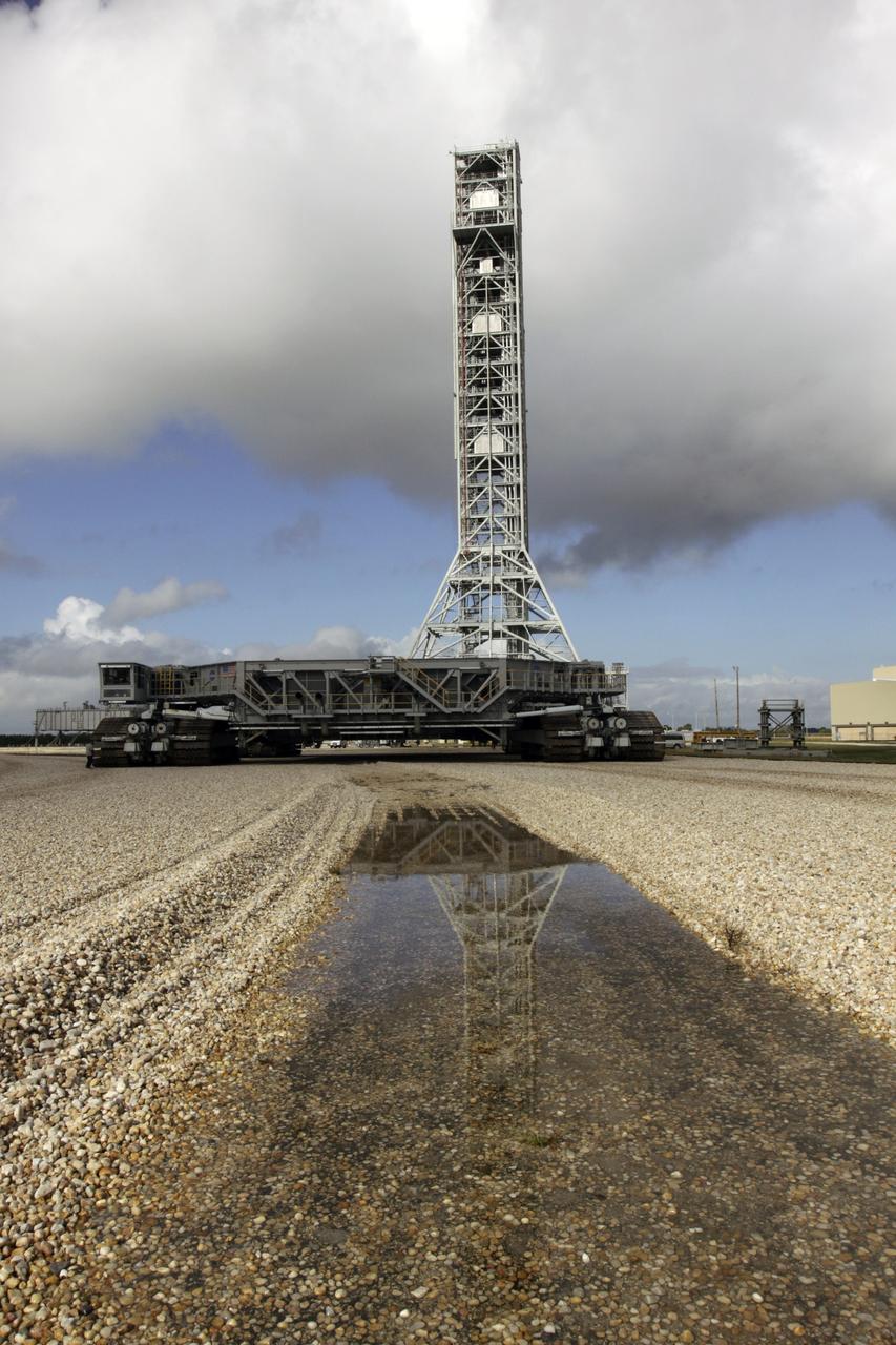 CAPE CANAVERAL, Fla. – At NASA's Kennedy Space Center in Florida, the mobile launcher (ML) is being prepared for its move aboard a crawler-transporter from next to Kennedy's Vehicle Assembly Building to Launch Pad 39B, a distance of 4.2 miles. Data on the ML will be collected from structural and functional engineering tests and used for the next phases of construction. The 355-foot-tall ML, which took about two years to construct, is being modified to support NASA's Space Launch System (SLS), the heavy-lift rocket that will launch astronauts farther into space than ever before. SLS will also create high-quality jobs here at home, and provide the cornerstone for America's future human space exploration efforts. For more information on SLS, visit http://www.nasa.gov/sls. Photo credit: NASA/Kim Shiflett