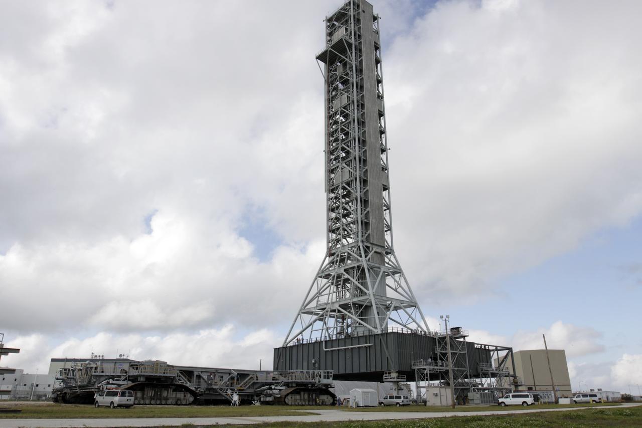 CAPE CANAVERAL, Fla. – At NASA's Kennedy Space Center in Florida, the mobile launcher (ML) is being prepared for its move aboard a crawler-transporter from next to Kennedy's Vehicle Assembly Building to Launch Pad 39B, a distance of 4.2 miles. Data on the ML will be collected from structural and functional engineering tests and used for the next phases of construction. The 355-foot-tall ML, which took about two years to construct, is being modified to support NASA's Space Launch System (SLS), the heavy-lift rocket that will launch astronauts farther into space than ever before. SLS will also create high-quality jobs here at home, and provide the cornerstone for America's future human space exploration efforts. For more information on SLS, visit http://www.nasa.gov/sls. Photo credit: NASA/Kim Shiflett
