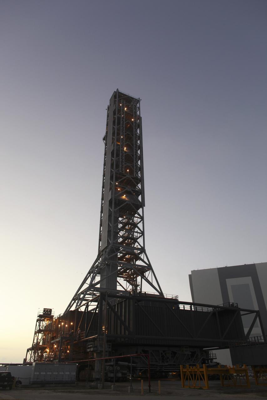 CAPE CANAVERAL, Fla. – At NASA’s Kennedy Space Center in Florida, the mobile launcher (ML) is being prepared for its move aboard a crawler-transporter from next to Kennedy's Vehicle Assembly Building to Launch Pad 39B, a distance of 4.2 miles. Data on the ML will be collected from structural and functional engineering tests and used for the next phases of construction. The 355-foot-tall ML structure, which took about two years to construct, is being modified to support NASA’s Space Launch System (SLS), the heavy-lift rocket that will launch astronauts farther into space than ever before. SLS will also create high-quality jobs here at home, and provide the cornerstone for America's future human space exploration efforts. Photo credit: NASA/Dimitri Gerondidakis