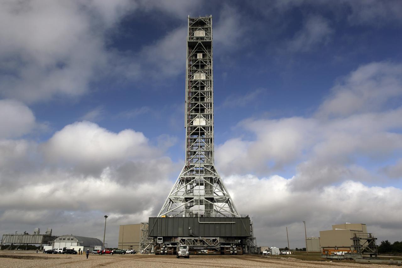 CAPE CANAVERAL, Fla. – At NASA’s Kennedy Space Center in Florida, the mobile launcher (ML) begins its move aboard a crawler-transporter from next to Kennedy's Vehicle Assembly Building to Launch Pad 39B, a distance of 4.2 miles. Data on the ML will be collected from structural and functional engineering tests and used for the next phases of construction. The 355-foot-tall ML structure, which took about two years to construct, is being modified to support NASA’s Space Launch System (SLS), the heavy-lift rocket that will launch astronauts farther into space than ever before. SLS will also create high-quality jobs here at home, and provide the cornerstone for America's future human space exploration efforts. Photo credit: NASA/Dimitri Gerondidakis