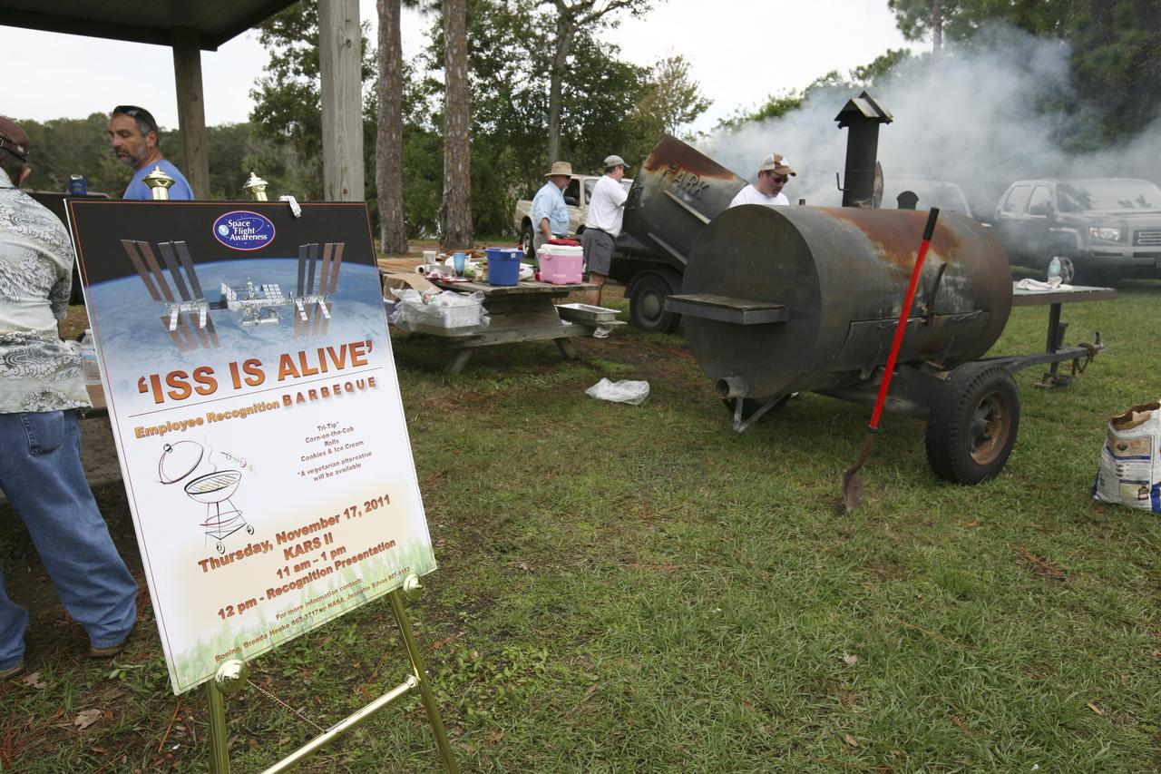 CAPE CANAVERAL, Fla. – International Space Station employees based at NASA's Kennedy Space Center in Florida participate in the "ISS Is Alive" employee recognition barbecue celebration at Kars Park II. NASA and The Boeing Co. hosted the celebration to thank the employees based at the Kennedy Space Center who were involved in building the largest, most complex international scientific project in history and the largest venture in space to date. The station has hosted human life, work and research in space for more than 10 years. Boeing is the prime contractor to NASA for the space station. In addition to designing and building all the major U.S. elements, Boeing also is responsible for ensuring the successful integration of new hardware and software -- including components from international partners -- as well as for providing sustaining engineering work. For more information on the International Space Station, visit http://www.nasa.gov/station. Photo credit: NASA/Amanda Diller