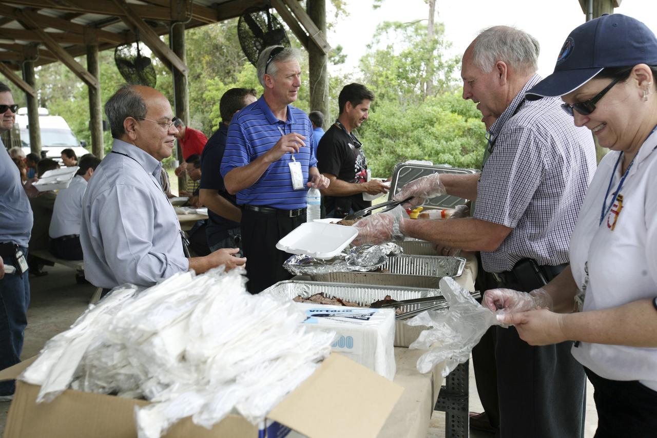 CAPE CANAVERAL, Fla. – International Space Station employees based at NASA's Kennedy Space Center in Florida participate in the "ISS Is Alive" employee recognition barbecue celebration at Kars Park II. The Boeing Co. and NASA hosted the celebration to thank the employees based at the Kennedy Space Center who were involved in building the largest, most complex international scientific project in history and the largest venture in space to date. The station has hosted human life, work and research in space for more than 10 years. Boeing is the prime contractor to NASA for the space station. In addition to designing and building all the major U.S. elements, Boeing also is responsible for ensuring the successful integration of new hardware and software -- including components from international partners -- as well as for providing sustaining engineering work. For more information on the International Space Station, visit http://www.nasa.gov/station. Photo credit: NASA/Amanda Diller