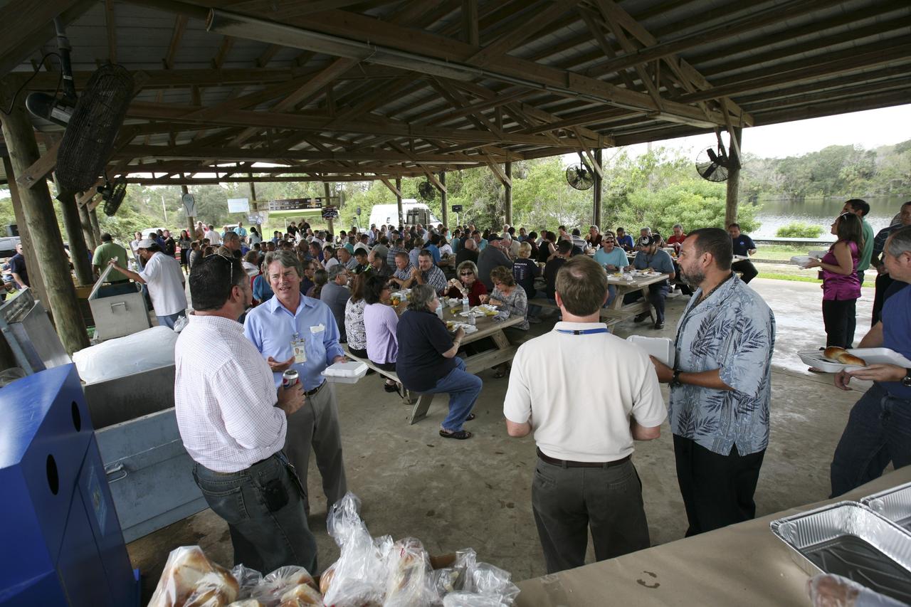 CAPE CANAVERAL, Fla. – International Space Station employees based at NASA's Kennedy Space Center in Florida participate in the "ISS Is Alive" employee recognition barbecue celebration at Kars Park II. The Boeing Co. and NASA hosted the celebration to thank the employees based at the Kennedy Space Center who were involved in building the largest, most complex international scientific project in history and the largest venture in space to date. The station has hosted human life, work and research in space for more than 10 years. Boeing is the prime contractor to NASA for the space station. In addition to designing and building all the major U.S. elements, Boeing also is responsible for ensuring the successful integration of new hardware and software -- including components from international partners -- as well as for providing sustaining engineering work. For more information on the International Space Station, visit http://www.nasa.gov/station. Photo credit: NASA/Amanda Diller