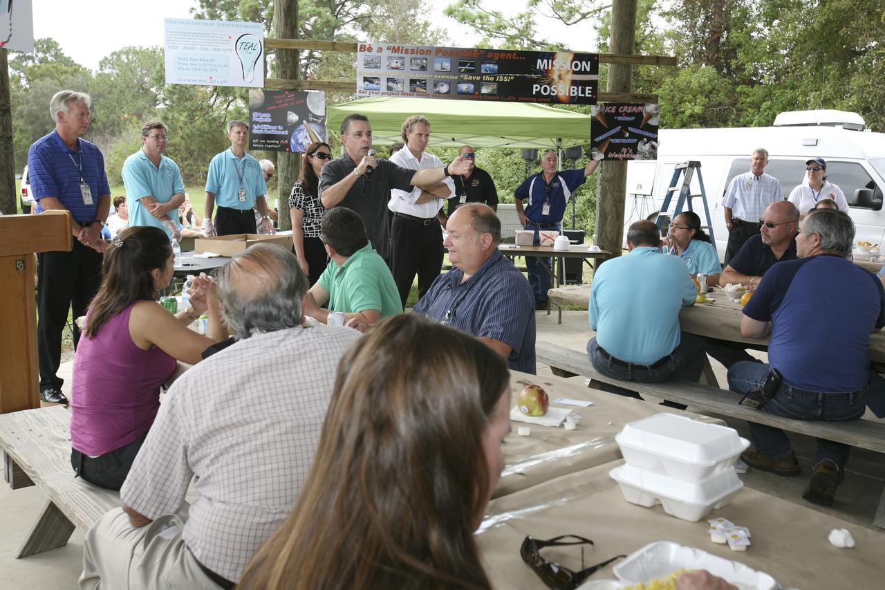 CAPE CANAVERAL, Fla. – Director Bill Dowdell talks to station employees based at NASA's Kennedy Space Center in Florida during the "ISS Is Alive" employee recognition barbecue celebration at Kars Park II. NASA and The Boeing Co. hosted the celebration to thank the employees based at the Kennedy Space Center who were involved in building the largest, most complex international scientific project in history and the largest venture in space to date. The station has hosted human life, work and research in space for more than 10 years. Boeing is the prime contractor to NASA for the space station. In addition to designing and building all the major U.S. elements, Boeing also is responsible for ensuring the successful integration of new hardware and software -- including components from international partners -- as well as for providing sustaining engineering work. For more information on the International Space Station, visit http://www.nasa.gov/station. Photo credit: NASA/Amanda Diller