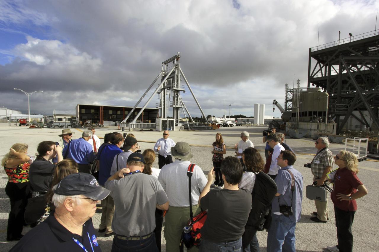 CAPE CANAVERAL, Fla. – Members of the media tour several facilities, including the Launch Equipment Test Facility in the Industrial Area, during the 21st Century Ground Systems Program Tour at Kennedy Space Center in Florida. Other tour stops were the Operations & Checkout Building, the Multi-Payload Processing Facility and the Canister Rotation Facility.       NASA’s 21st Century Ground Systems Program was initiated at Kennedy Space Center to establish the needed launch and processing infrastructure to support the Space Launch System Program and to work toward transforming the landscape of the launch site for a multi-faceted user community. Photo credit: NASA/Jim Grossmann