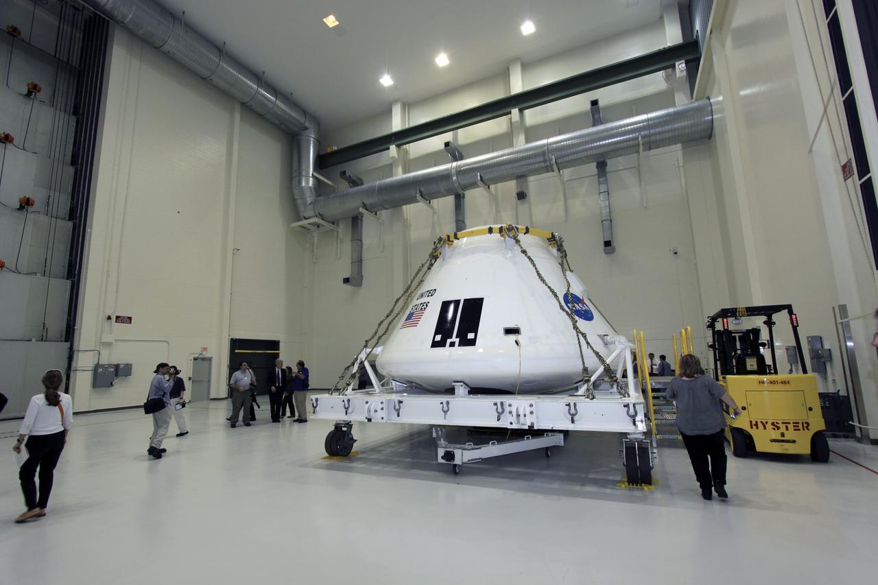 CAPE CANAVERAL, Fla. – Members of the media tour several facilities, including the Operations & Checkout Building high bay where NASA’s Multi-Purpose Crew Vehicle Orion will be processed, during the 21st Century Ground Systems Program Tour at Kennedy Space Center in Florida. Other tour stops were the Launch Equipment Test Facility, the Multi-Payload Processing Facility and the Canister Rotation Facility.    NASA’s 21st Century Ground Systems Program was initiated at Kennedy Space Center to establish the needed launch and processing infrastructure to support the Space Launch System Program and to work toward transforming the landscape of the launch site for a multi-faceted user community. Photo credit: NASA/Jim Grossmann