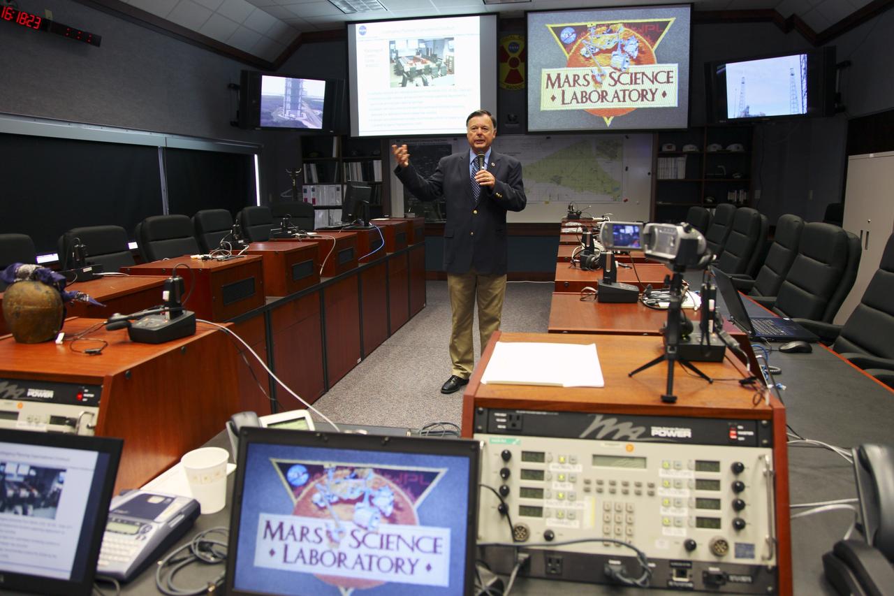CAPE CANAVERAL, Fla. -- Surrounded by monitors and consoles, Randy Scott, director of Kennedy Space Center's Radiological Control Center (RADCC), speaks to media during a tour regarding safety equipment and procedures for the upcoming launch of the Mars Science Laboratory (MSL) mission.     The MSL spacecraft includes a multi-mission radioisotope thermoelectric generator (MMRTG) that will generate the power needed for the mission from the natural decay of plutonium-238, a non-weapons-grade form of the radioisotope. MSL's components include a car-sized rover, Curiosity, which has 10 science instruments designed to search for signs of life, including methane, and help determine if the gas is from a biological or geological source. Launch of MSL aboard a United Launch Alliance Atlas V rocket is targeted for Nov. 26 from Space Launch Complex 41 on Cape Canaveral Air Force Station. For more information, visit http://www.nasa.gov/msl. Photo credit: NASA/Frankie Martin