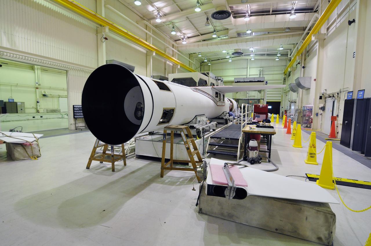 VANDENBERG AIR FORCE BASE, Calif. -- Inside a Pegasus booster processing facility at Vandenberg Air Force Base in California, a fin (lower right) for the aft end of the Pegasus XL rocket's first stage is ready for installation.               The Orbital Sciences Corp. Pegasus rocket will launch the Nuclear Spectroscopic Telescope Array (NuSTAR) into space. After the rocket and spacecraft are processed at Vandenberg, they will be flown on the Orbital Sciences’ L-1011 carrier aircraft to the Ronald Reagan Ballistic Missile Defense Test Site at the Pacific Ocean’s Kwajalein Atoll for launch. The high-energy x-ray telescope will conduct a census for black holes, map radioactive material in young supernovae remnants, and study the origins of cosmic rays and the extreme physics around collapsed stars. For more information, visit science.nasa.gov/missions/nustar/. Photo credit: NASA/Randy Beaudoin, VAFB