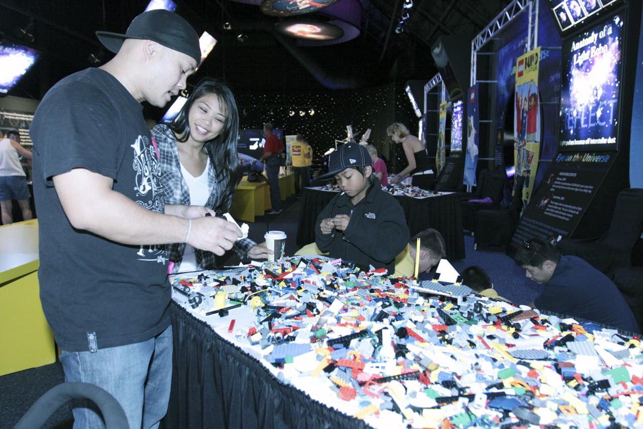 CAPE CANAVERAL, Fla. – Families visiting the Kennedy Space Center Visitor Complex in Florida participate in a LEGO "Build the Future" event.     The festivities coincide with the launch of NASA's Mars Science Laboratory (MSL), carrying a compact car-sized rover, Curiosity, to the red planet. Part of the Space Act Agreement between NASA and LEGO A/S, the activities are designed to inspire students of every age to consider an education and careers in the science, technology, engineering and mathematics, or STEM, disciplines. Launch of MSL aboard a United Launch Alliance Atlas V rocket is scheduled for Nov. 26 from Space Launch Complex-41 on Cape Canaveral Air Force Station in Florida. For more information, visit http://www.nasa.gov/audience/foreducators/nasa-lego-partnership.html. Photo credit: NASA/Kim Shiflett