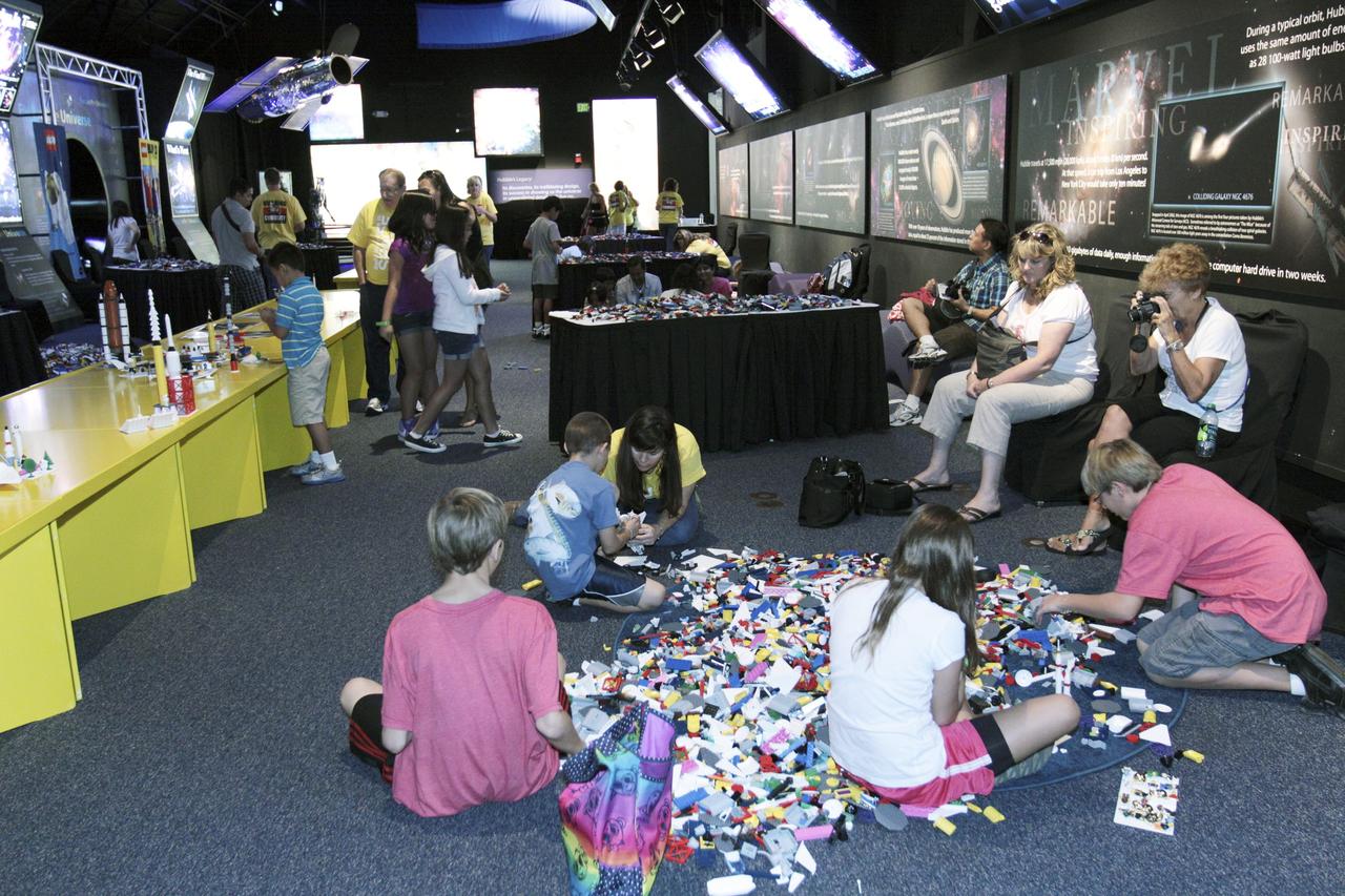 CAPE CANAVERAL, Fla. – LEGO blocks are spread out on the floor of an exhibition hall at the Kennedy Space Center Visitor Complex in Florida for easy access during the LEGO "Build the Future" event.     The festivities coincide with the launch of NASA's Mars Science Laboratory (MSL), carrying a compact car-sized rover, Curiosity, to the red planet. Part of the Space Act Agreement between NASA and LEGO A/S, the activities are designed to inspire students of every age to consider an education and careers in the science, technology, engineering and mathematics, or STEM, disciplines. Launch of MSL aboard a United Launch Alliance Atlas V rocket is scheduled for Nov. 26 from Space Launch Complex-41 on Cape Canaveral Air Force Station in Florida. For more information, visit http://www.nasa.gov/audience/foreducators/nasa-lego-partnership.html. Photo credit: NASA/Kim Shiflett