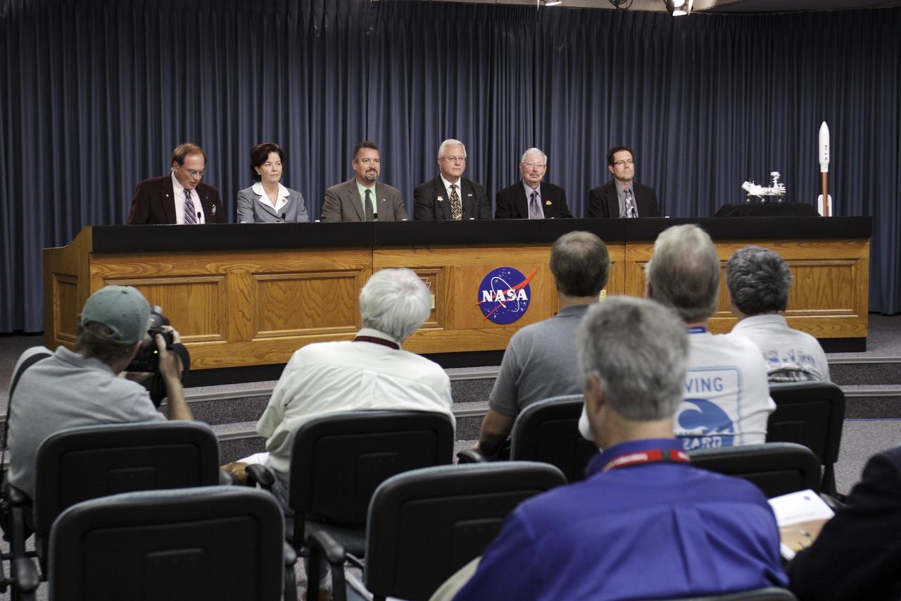 CAPE CANAVERAL, Fla. – Media representatives participate in a prelaunch news conference for the Mars Science Laboratory (MSL) in the Press Site auditorium at NASA’s Kennedy Space Center in Florida. From left are NASA Public Affairs Officer George Diller; Colleen Hartman, assistant associate administrator, NASA Science Mission Directorate; Omar Baez, NASA launch director; Vernon Thorp, program manager, NASA Missions, United Launch Alliance; Peter Theisinger, MSL project manager; and Clay Flinn, launch weather officer 45th Weather Squadron, Cape Canaveral Air Force Station, Fla.  MSL’s components include a car-sized rover, Curiosity, which has 10 science instruments designed to search for signs of life, including methane, and help determine if the gas is from a biological or geological source. Launch of MSL aboard a United Launch Alliance Atlas V rocket is scheduled for Nov. 26 from Space Launch Complex-41 on Cape Canaveral Air Force Station in Florida. For more information, visit http://www.nasa.gov/msl. Photo credit: NASA/Kim Shiflett