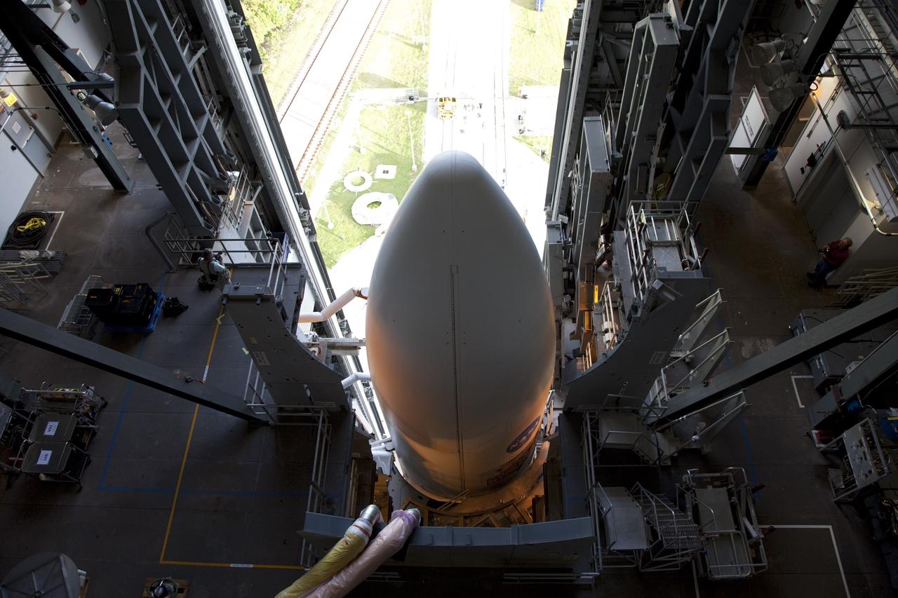 CAPE CANAVERAL, Fla. -- On Cape Canaveral Air Force Station in Florida, the payload fairing protecting NASA's Mars Science Laboratory (MSL) stands atop the 197-foot-tall United Launch Alliance Atlas V rocket, which is ready to roll from the Vertical Integration Facility (VIF) to the launch pad at Space Launch Complex 41. The rocket began its move from the VIF at 8 a.m. EST and arrived at the pad at 8:40 a.m. Liftoff is planned during a launch window which extends from 10:02 a.m. to 11:45 a.m. EST on Nov. 26. MSL's components include a car-sized rover, Curiosity, which has 10 science instruments designed to search for signs of life, including methane, and help determine if the gas is from a biological or geological source. For more information, visit http://www.nasa.gov/msl. Photo credit: NASA/Frankie Martin