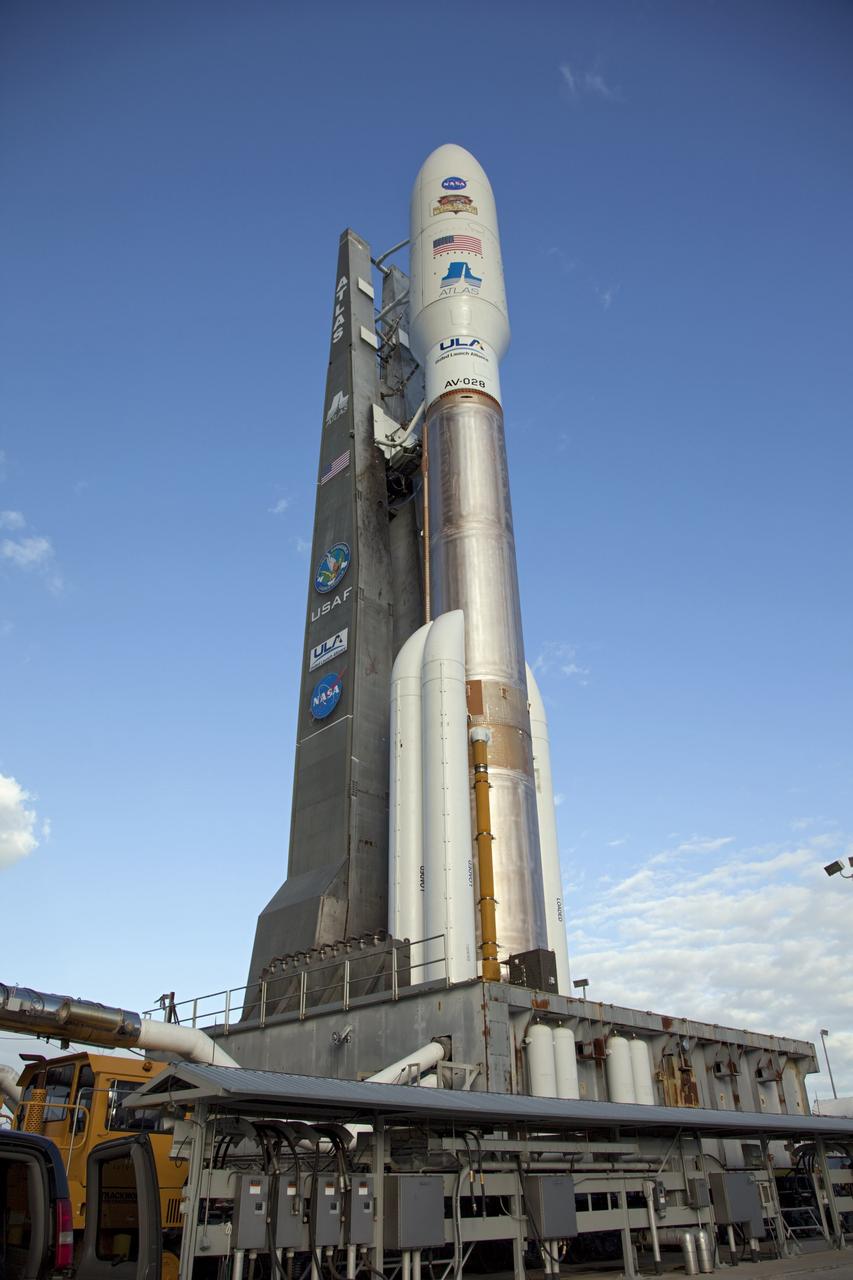 CAPE CANAVERAL, Fla. -- On Cape Canaveral Air Force Station in Florida, the 197-foot-tall United Launch Alliance Atlas V rocket is backdropped by a bright blue sky as the vehicle rolls from the Vertical Integration Facility (VIF) to the launch pad at Space Launch Complex 41. Atop the rocket is NASA's Mars Science Laboratory (MSL), enclosed in its payload fairing. The rocket began its move from the VIF at 8 a.m. EST and arrived at the pad at 8:40 a.m.    Liftoff is planned during a launch window which extends from 10:02 a.m. to 11:45 a.m. EST on Nov. 26. MSL's components include a car-sized rover, Curiosity, which has 10 science instruments designed to search for signs of life, including methane, and help determine if the gas is from a biological or geological source. For more information, visit http://www.nasa.gov/msl. Photo credit: NASA/Frankie Martin