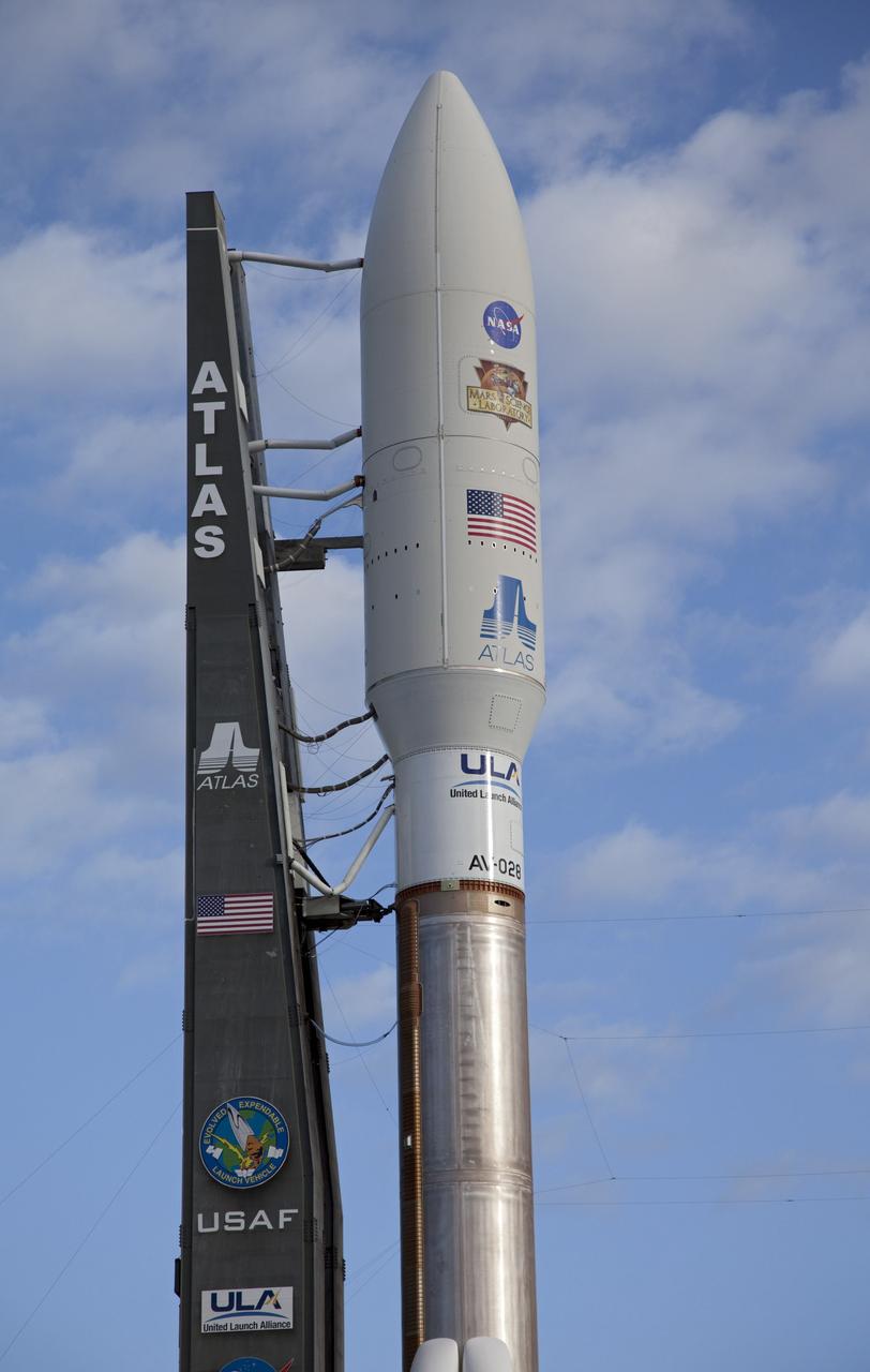 CAPE CANAVERAL, Fla. -- On Cape Canaveral Air Force Station in Florida, the payload fairing protecting NASA's Mars Science Laboratory (MSL) stands atop the 197-foot-tall United Launch Alliance Atlas V rocket during rollout to the launch pad at Space Launch Complex 41. The rocket began its move from the Vertical Integration Facility at 8 a.m. EST and arrived at the pad at 8:40 a.m.    Liftoff is planned during a launch window which extends from 10:02 a.m. to 11:45 a.m. EST on Nov. 26. MSL's components include a car-sized rover, Curiosity, which has 10 science instruments designed to search for signs of life, including methane, and help determine if the gas is from a biological or geological source. For more information, visit http://www.nasa.gov/msl. Photo credit: NASA/Frankie Martin