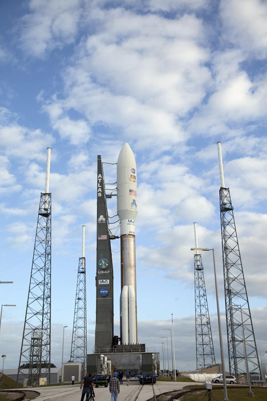 CAPE CANAVERAL, Fla. -- The 197-foot-tall United Launch Alliance Atlas V rocket seems surrounded by lightning masts as it arrives at the launch pad at Space Launch Complex 41 on Cape Canaveral Air Force Station in Florida. Atop the rocket is NASA's Mars Science Laboratory (MSL), enclosed in its payload fairing. The rocket began its move from the Vertical Integration Facility at 8 a.m. EST and arrived at the pad at 8:40 a.m. Liftoff is planned during a launch window which extends from 10:02 a.m. to 11:45 a.m. EST on Nov. 26. MSL's components include a car-sized rover, Curiosity, which has 10 science instruments designed to search for signs of life, including methane, and help determine if the gas is from a biological or geological source. For more information, visit http://www.nasa.gov/msl. Photo credit: NASA/Frankie Martin