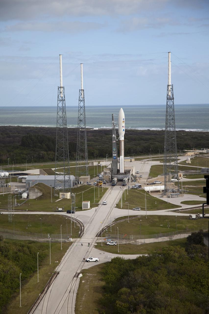 CAPE CANAVERAL, Fla. -- On Cape Canaveral Air Force Station in Florida, the 197-foot-tall United Launch Alliance Atlas V rocket is in place at Space Launch Complex 41 after rolling out from the nearby Vertical Integration Facility (VIF). Atop the rocket is NASA's Mars Science Laboratory (MSL), enclosed in its payload fairing. The rocket began its move from the Vertical Integration Facility at 8 a.m. EST and arrived at the pad at 8:40 a.m. Liftoff is planned during a launch window which extends from 10:02 a.m. to 11:45 a.m. EST on Nov. 26. MSL's components include a car-sized rover, Curiosity, which has 10 science instruments designed to search for signs of life, including methane, and help determine if the gas is from a biological or geological source. For more information, visit http://www.nasa.gov/msl. Photo credit: NASA/Frankie Martin