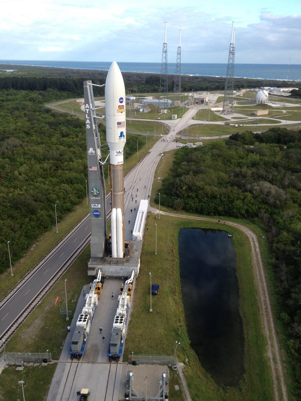 CAPE CANAVERAL, Fla. -- Backdropped by the Atlantic Ocean, the 197-foot-tall United Launch Alliance Atlas V rocket rolls toward the launch pad at Space Launch Complex 41 on Cape Canaveral Air Force Station in Florida. Atop the rocket is NASA's Mars Science Laboratory (MSL), enclosed in its payload fairing. The rocket began its move from the Vertical Integration Facility at 8 a.m. EST, arriving at the launch pad at 8:40 a.m. Liftoff is planned during a launch window which extends from 10:02 a.m. to 11:45 a.m. EST on Nov. 26. MSL's components include a car-sized rover, Curiosity, which has 10 science instruments designed to search for signs of life, including methane, and help determine if the gas is from a biological or geological source. For more information, visit http://www.nasa.gov/msl. Photo credit: Courtesy Scott Andrews