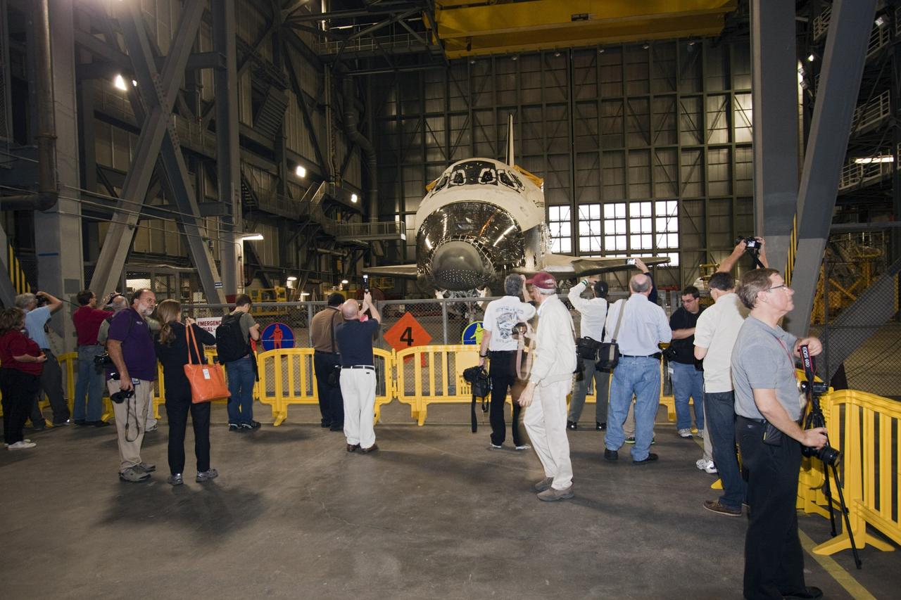 CAPE CANAVERAL, Fla. – At NASA Kennedy Space Center in Florida, media representatives taking the 21st Century Ground Systems tour get a close-up look at space shuttle Endeavour which is being stored in the Vehicle Assembly Building. Other stops on the tour include a crawler-transporter parked on the crawlerway, the new mobile launcher on Launch Pad 39B, and the Launch Control Center's Firing Room 1. These facilities and equipment will be used to prepare and launch NASA's new Orion spacecraft on the Space Launch System heavy-lift rocket. The tour was arranged as part of prelaunch media activities for the agency's Mars Science Laboratory (MSL) launch. Liftoff of MSL aboard a United Launch Alliance Atlas V rocket from Space Launch Complex-41 on Cape Canaveral Air Force Station is planned during a launch window which extends from 10:02 a.m. to 11:45 a.m. EST on Nov. 26. For more information, visit http://www.nasa.gov/msl. Photo credit: NASA/Jim Grossmann