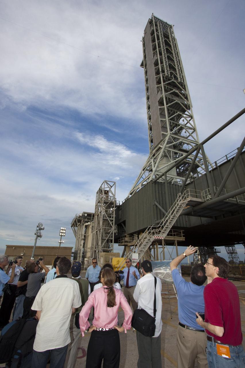 CAPE CANAVERAL, Fla. – At NASA Kennedy Space Center in Florida, Jose Perez-Morales (right), NASA launch pad project manager, and Larry Schultz, NASA mobile launcher project manager, outline the upgrades to Launch Pad 39B and the mobile launcher to support NASA's forthcoming Space Launch System heavy-lift rocket. Their audience is made up of media representatives taking the 21st Century Ground Systems tour. Other stops on the tour include the Vehicle Assembly Building, a crawler-transporter parked on the crawlerway, and the Launch Control Center's Firing Room 1. These facilities and equipment will be used to prepare and launch NASA's new Orion spacecraft.    The tour was arranged as part of prelaunch media activities for the agency's Mars Science Laboratory (MSL) launch. Liftoff of MSL aboard a United Launch Alliance Atlas V rocket from Space Launch Complex-41 on Cape Canaveral Air Force Station is planned during a launch window which extends from 10:02 a.m. to 11:45 a.m. EST on Nov. 26. For more information, visit http://www.nasa.gov/msl. Photo credit: NASA/Jim Grossmann