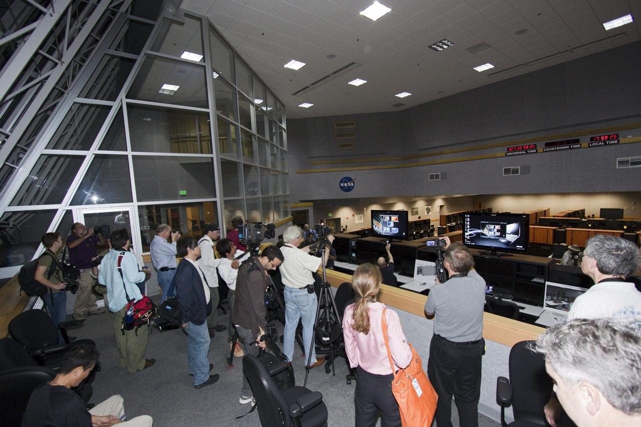 CAPE CANAVERAL, Fla. – At NASA Kennedy Space Center in Florida, media representatives tour the Launch Control Center's Firing Room 1. They are taking the 21st Century Ground Systems tour which also includes the Vehicle Assembly Building, a crawler-transporter parked on the crawlerway, and the new mobile launcher on Launch Pad 39B. These facilities and equipment will be used to prepare and launch NASA's new Orion spacecraft on the Space Launch System heavy-lift rocket. The tour was arranged as part of prelaunch media activities for the agency's Mars Science Laboratory (MSL) launch. Liftoff of MSL aboard a United Launch Alliance Atlas V rocket from Space Launch Complex-41 on Cape Canaveral Air Force Station is planned during a launch window which extends from 10:02 a.m. to 11:45 a.m. EST on Nov. 26. For more information, visit http://www.nasa.gov/msl. Photo credit: NASA/Jim Grossmann