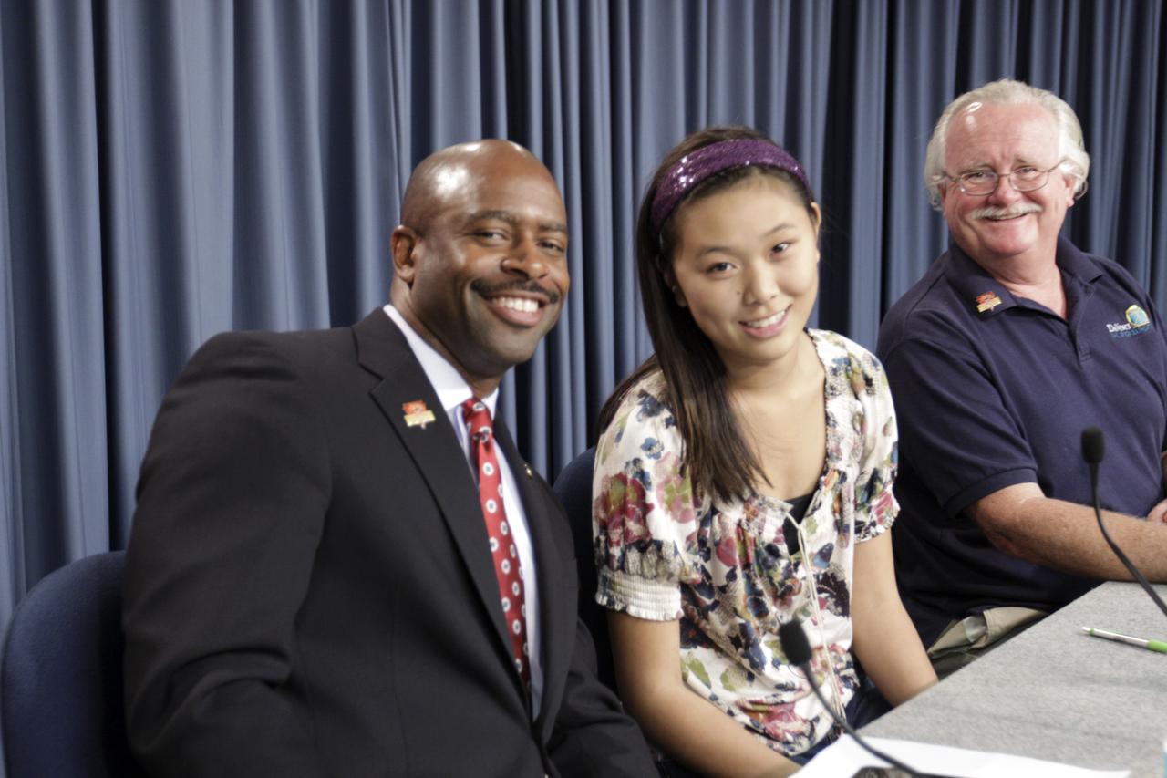 CAPE CANAVERAL, Fla. – Leland Melvin, NASA associate administrator for Education; Clara Ma, student, NASA contest winner for naming Curiosity, Shawnee Mission East High School, Prairie Village, Kansas; Scott Anderson, teacher and science department chairman Da Vinci School for Science and the Arts, El Paso, Texas, take a moment pose for the camera before the start of an educational news conference to explore "Why Mars Excites and Inspires Us" in NASA Kennedy Space Center's Press Site auditorium in Florida during prelaunch activities for the agency’s Mars Science Laboratory (MSL) launch. MSL's car-sized Martian rover, Curiosity, has 10 science instruments designed to search for signs of life, including methane, and help determine if the gas is from a biological or geological source. Ma's entry was selected the winner from 9,000 entries in NASA's nationwide student contest to name the rover. At the time, she was a twelve-year-old sixth-grade student at the Sunflower Elementary school in Lenexa, Kansas. Liftoff of MSL aboard a United Launch Alliance Atlas V rocket from Space Launch Complex-41 on Cape Canaveral Air Force Station is planned during a launch window which extends from 10:02 a.m. to 11:45 a.m. EST on Nov. 26. For more information, visit http://www.nasa.gov/msl. Photo credit: NASA/Kim Shiflett