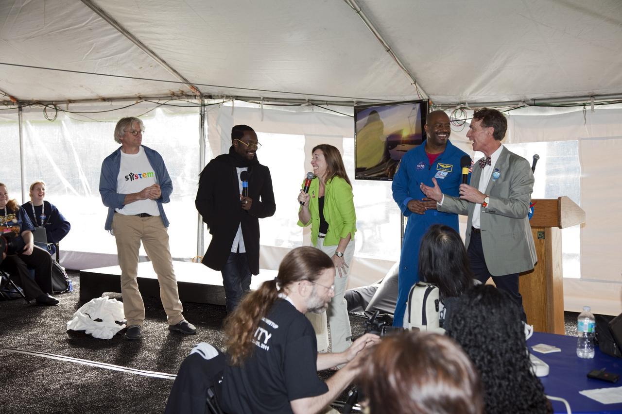 CAPE CANAVERAL, Fla. – From left, Lars Perkins, chair of the Education and Public Outreach Committee of the NASA Advisory Council; Will.i.am, entertainer and member of the pop group The Black Eyed Peas; NASA Deputy Administrator Lori Garver; former astronaut Leland Melvin, NASA associate administrator for Education; and television personality Bill Nye the Science Guy share a light moment with the participants of a NASA Tweetup in a tent set up at NASA Kennedy Space Center's Press Site in Florida during prelaunch activities for the agency’s Mars Science Laboratory (MSL) launch.  Participants in the Tweetup are given the opportunity to listen to agency briefings, tour locations on the center normally off limits to visitors, and get a close-up view of Space Launch Complex-41 on Cape Canaveral Air Force Station. The tweeters will share their experiences with followers through the social networking site Twitter. The MSL mission will pioneer precision landing technology and a sky-crane touchdown to place a car-sized rover, Curiosity, near the foot of a mountain inside Gale Crater on Aug. 6, 2012. During a nearly two-year prime mission after landing, the rover will investigate whether the region has ever offered conditions favorable for microbial life, including the chemical ingredients for life.  Liftoff of MSL aboard a United Launch Alliance Atlas V rocket from pad 41 is planned during a launch window which extends from 10:02 a.m. to 11:45 a.m. EST on Nov. 26. For more information, visit http://www.nasa.gov/msl. Photo credit: NASA/Frankie Martin