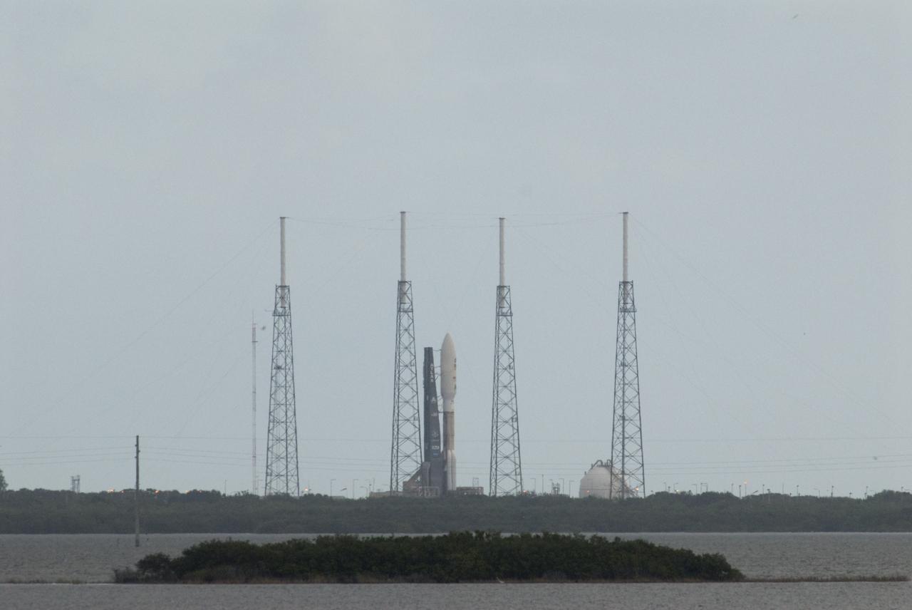 CAPE CANAVERAL, Fla. – Four towering lightning protection masts seem to stand guard as NASA's Mars Science Laboratory (MSL) spacecraft, sealed inside its payload fairing, awaits liftoff aboard the United Launch Alliance Atlas V rocket. MSL lifted off from Space Launch Complex 41 on Cape Canaveral Air Force Station in Florida at 10:02 a.m. EST Nov. 26, beginning a 9-month interplanetary cruise to Mars. MSL's components include a car-sized rover, Curiosity, which has 10 science instruments designed to search for signs of life, including methane, and help determine if the gas is from a biological or geological source. For more information, visit http://www.nasa.gov/msl. Photo credit: NASA/Bill White