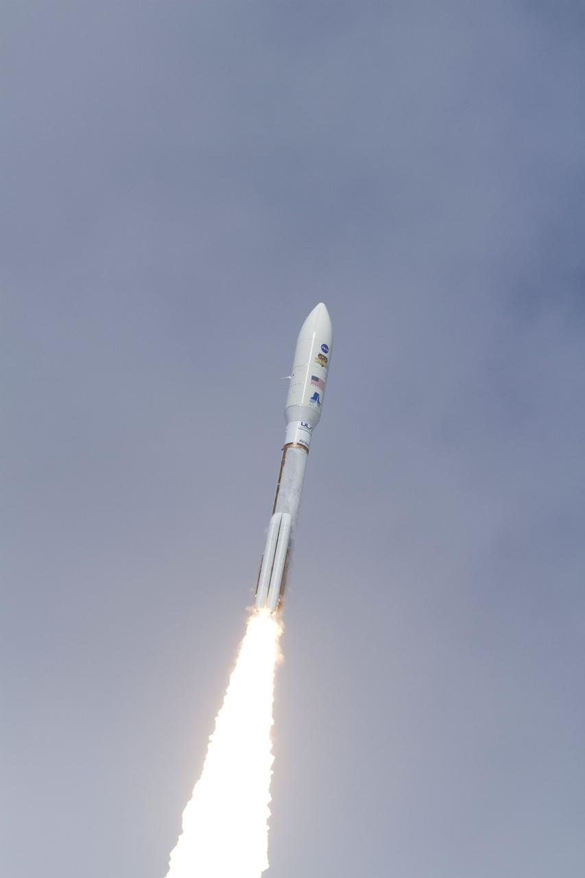 CAPE CANAVERAL, Fla. -- With NASA's Mars Science Laboratory (MSL) spacecraft sealed inside its payload fairing, the United Launch Alliance Atlas V rocket rides a plume of flames as it climbs into the blue sky over Space Launch Complex-41 on Cape Canaveral Air Force Station in Florida at 10:02 a.m. EST Nov. 26. MSL's components include a car-sized rover, Curiosity, which has 10 science instruments designed to search for signs of life, including methane, and help determine if the gas is from a biological or geological source. For more information, visit http://www.nasa.gov/msl. Photo credit: NASA/George Roberts