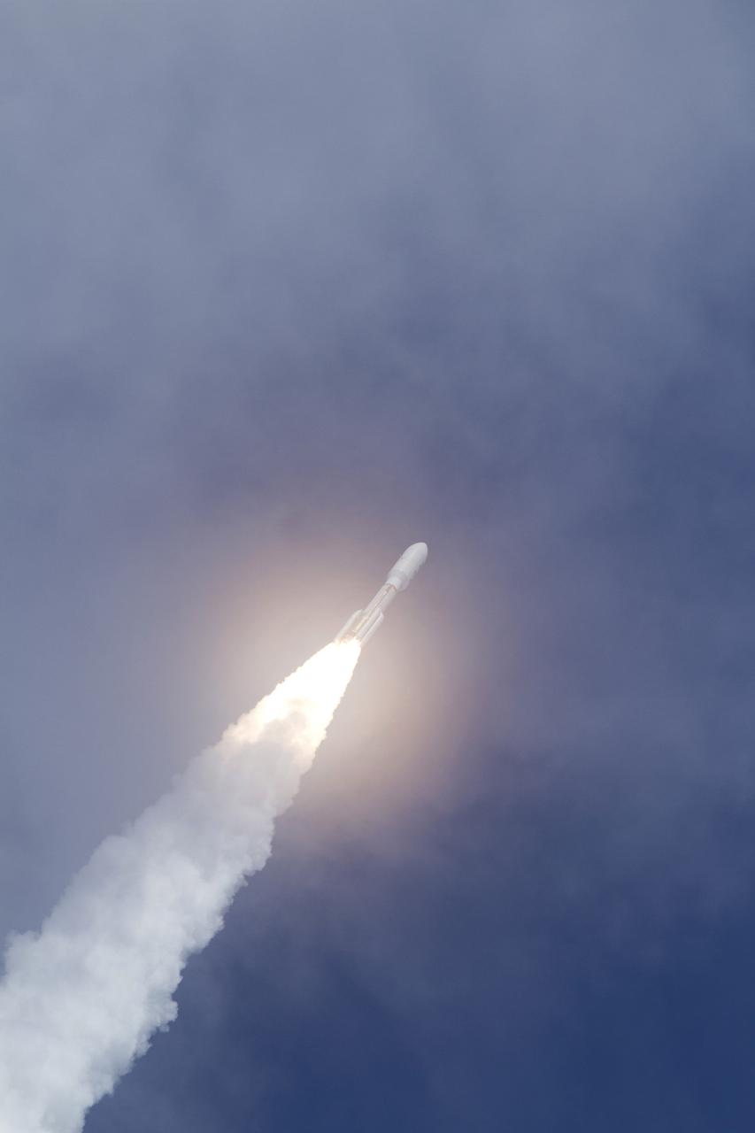 CAPE CANAVERAL, Fla. -- With NASA's Mars Science Laboratory (MSL) spacecraft sealed inside its payload fairing, the United Launch Alliance Atlas V rocket rides a plume of flames as it continues its assent into the blue sky over Space Launch Complex-41 on Cape Canaveral Air Force Station in Florida at 10:02 a.m. EST Nov. 26.      MSL's components include a car-sized rover, Curiosity, which has 10 science instruments designed to search for signs of life, including methane, and help determine if the gas is from a biological or geological source. For more information, visit http://www.nasa.gov/msl. Photo credit: NASA/George Roberts