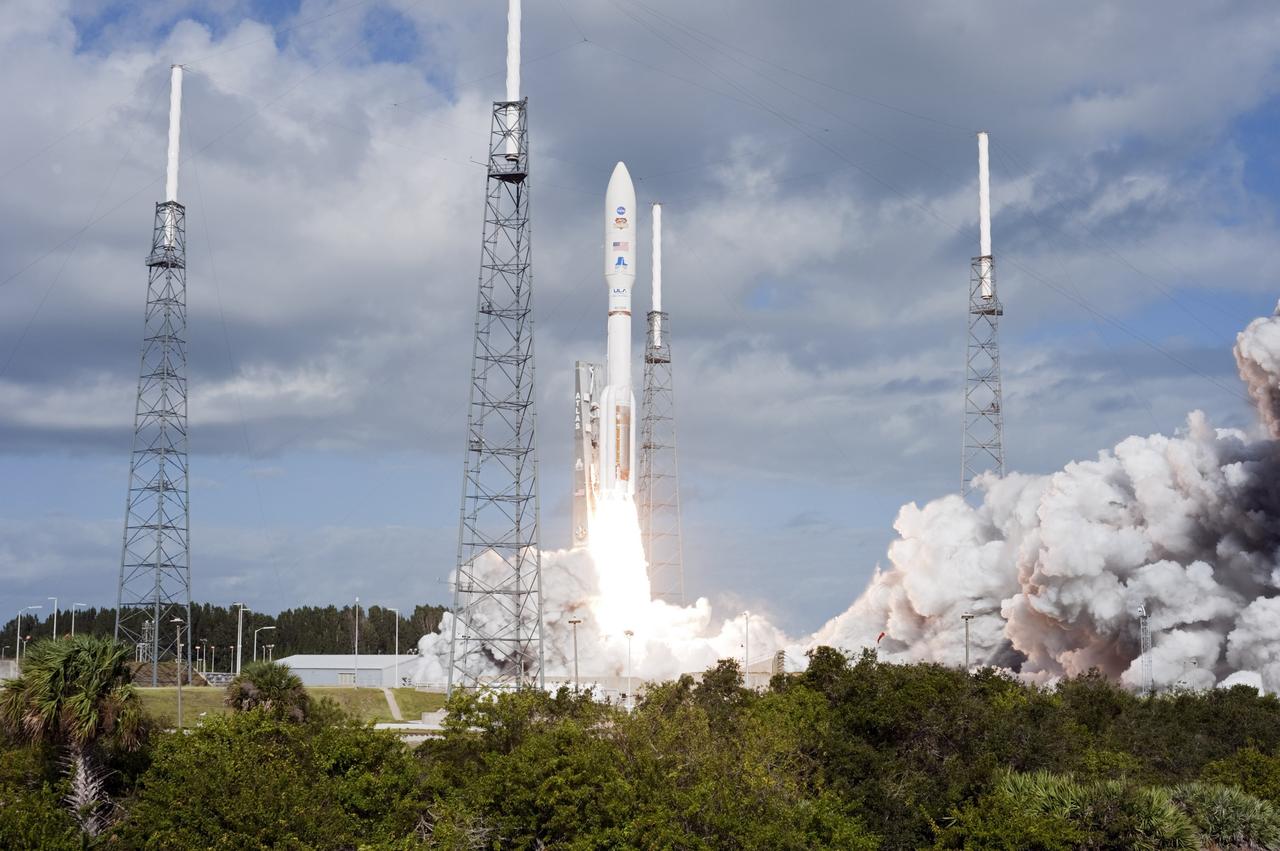 CAPE CANAVERAL, Fla. -- The United Launch Alliance Atlas V rocket carrying NASA's Mars Science Laboratory (MSL) spacecraft rides a plume of flames as it lifts off from Space Launch Complex-41 at Cape Canaveral Air Force Station in Florida at 10:02 a.m. EST Nov. 26. MSL's components include a car-sized rover, Curiosity, which has 10 science instruments designed to search for signs of life, including methane, and help determine if the gas is from a biological or geological source. For more information, visit http://www.nasa.gov/msl. Photo credit: NASA/Tony Gray and Rick Wetherington