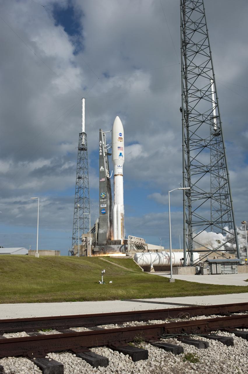 CAPE CANAVERAL, Fla. -- At ignition, a glow of flame is barely visible beneath the United Launch Alliance Atlas V rocket as it launches with NASA's Mars Science Laboratory (MSL) spacecraft. MSL lifted off from Space Launch Complex-41 at Cape Canaveral Air Force Station in Florida at 10:02 a.m. EST Nov. 26. MSL's components include a car-sized rover, Curiosity, which has 10 science instruments designed to search for signs of life, including methane, and help determine if the gas is from a biological or geological source. For more information, visit http://www.nasa.gov/msl. Photo credit: NASA/Tony Gray and Rick Wetherington