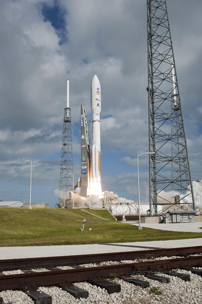 CAPE CANAVERAL, Fla. -- The United Launch Alliance Atlas V rocket carrying NASA's Mars Science Laboratory (MSL) spacecraft begins to rise from Space Launch Complex-41 at Cape Canaveral Air Force Station in Florida at 10:02 a.m. EST Nov. 26. MSL's components include a car-sized rover, Curiosity, which has 10 science instruments designed to search for signs of life, including methane, and help determine if the gas is from a biological or geological source. For more information, visit http://www.nasa.gov/msl. Photo credit: NASA/Tony Gray and Rick Wetherington